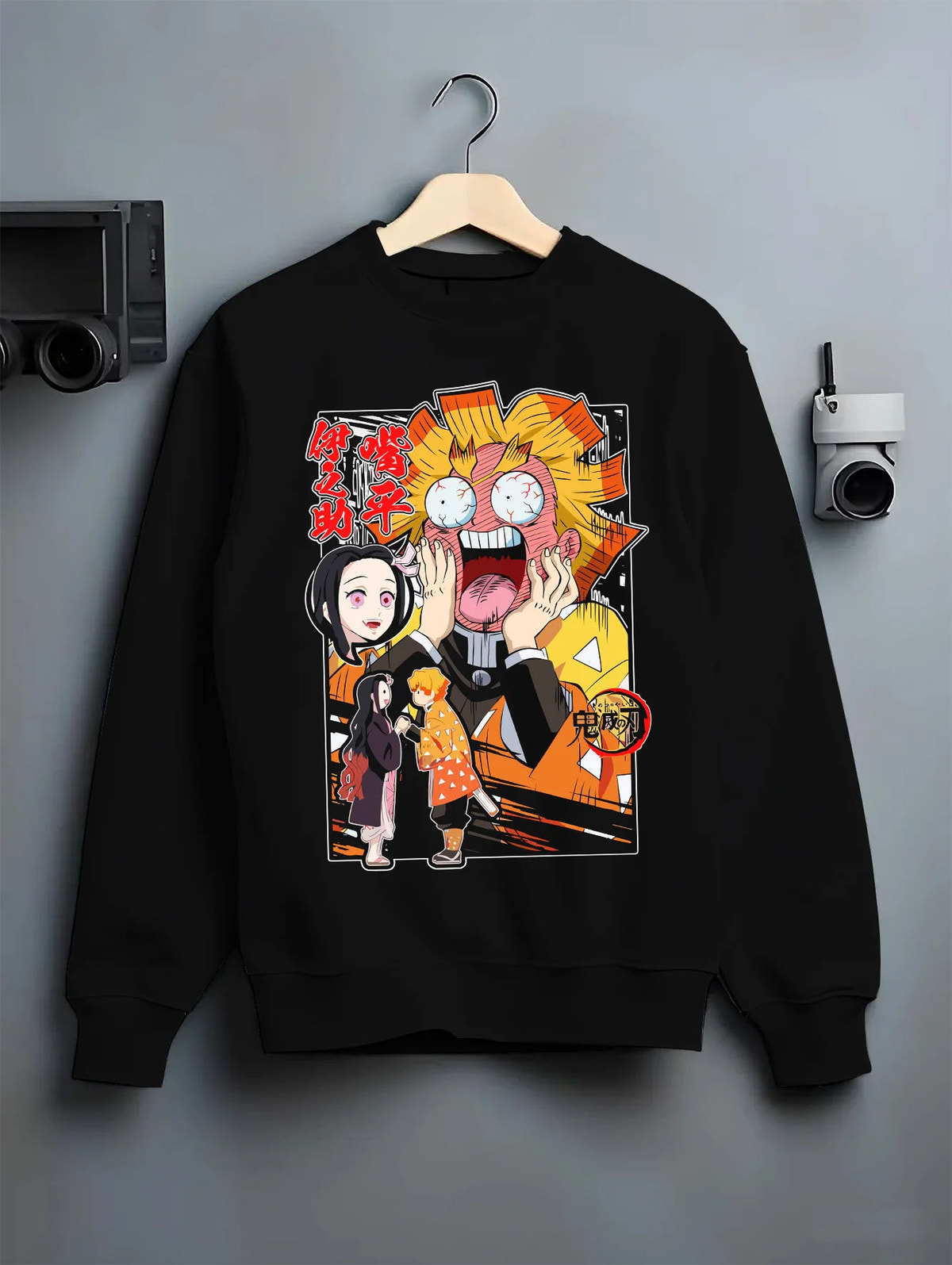 Black crewneck sweatshirt on hanger showing Zenitsu Agatsuma and Nezuko Kamado from Demon Slayer: exaggerated comic scene