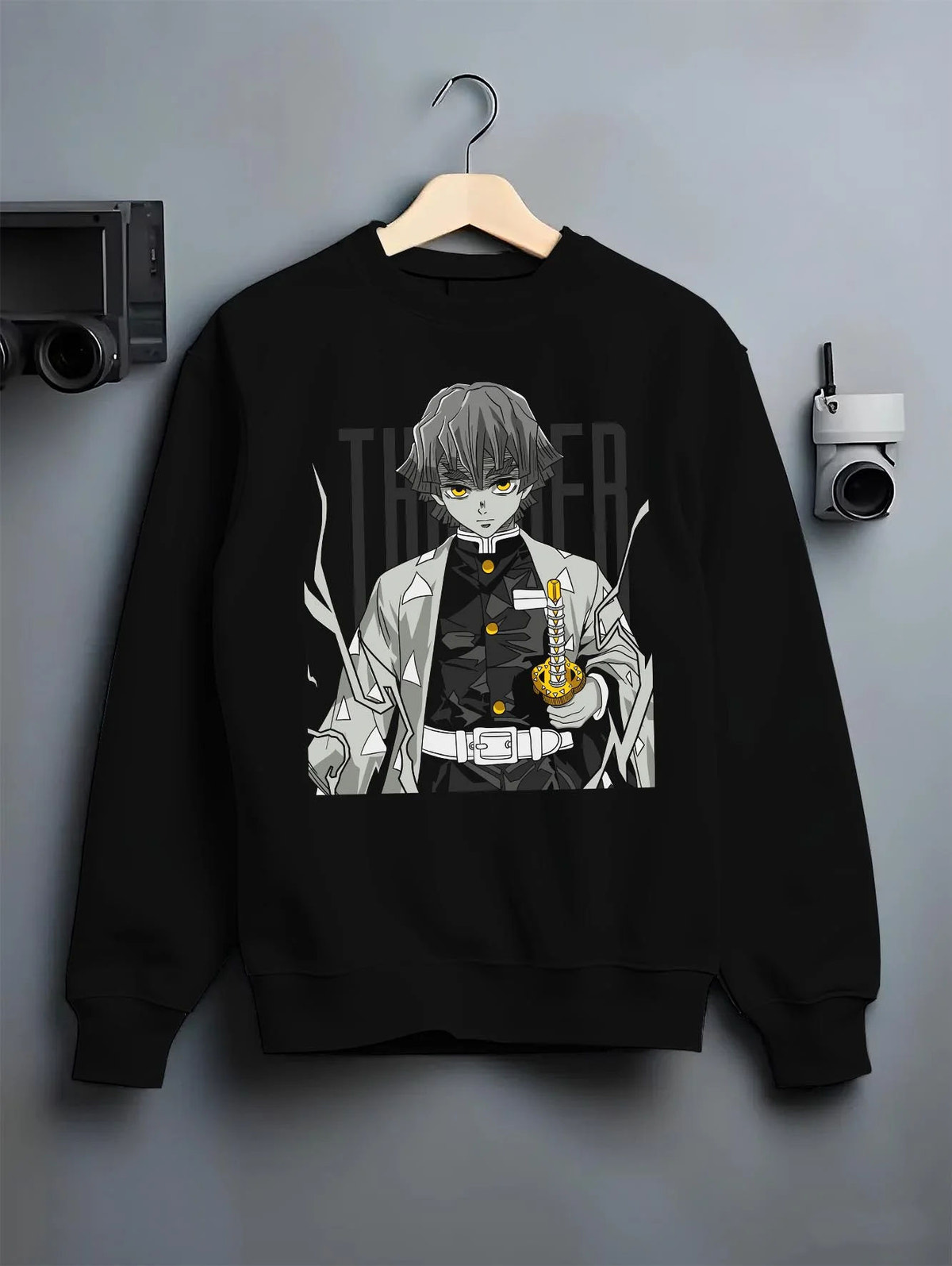 Black crewneck sweatshirt on hanger featuring Zenitsu Agatsuma sleeping swordsman Demon Slayer artwork.