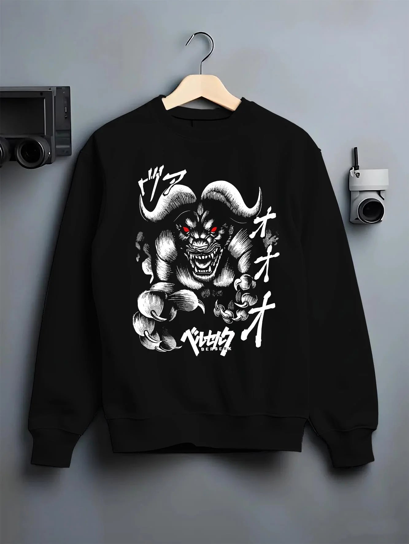 Black crewneck sweatshirt on hanger with Zodd Hoodie Berserk Apostle Demon Beast Swordsman graphic bold anime graphic.