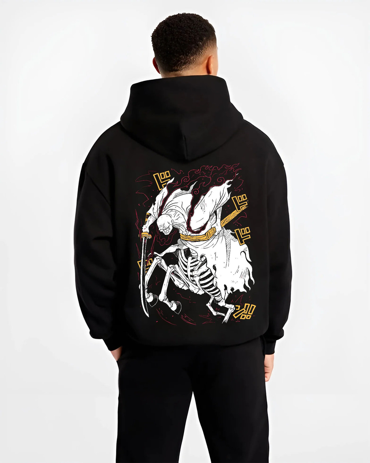 Black hoodie model back view with Stylised skeleton swordsman with three swords from One Piece illustrated back graphic