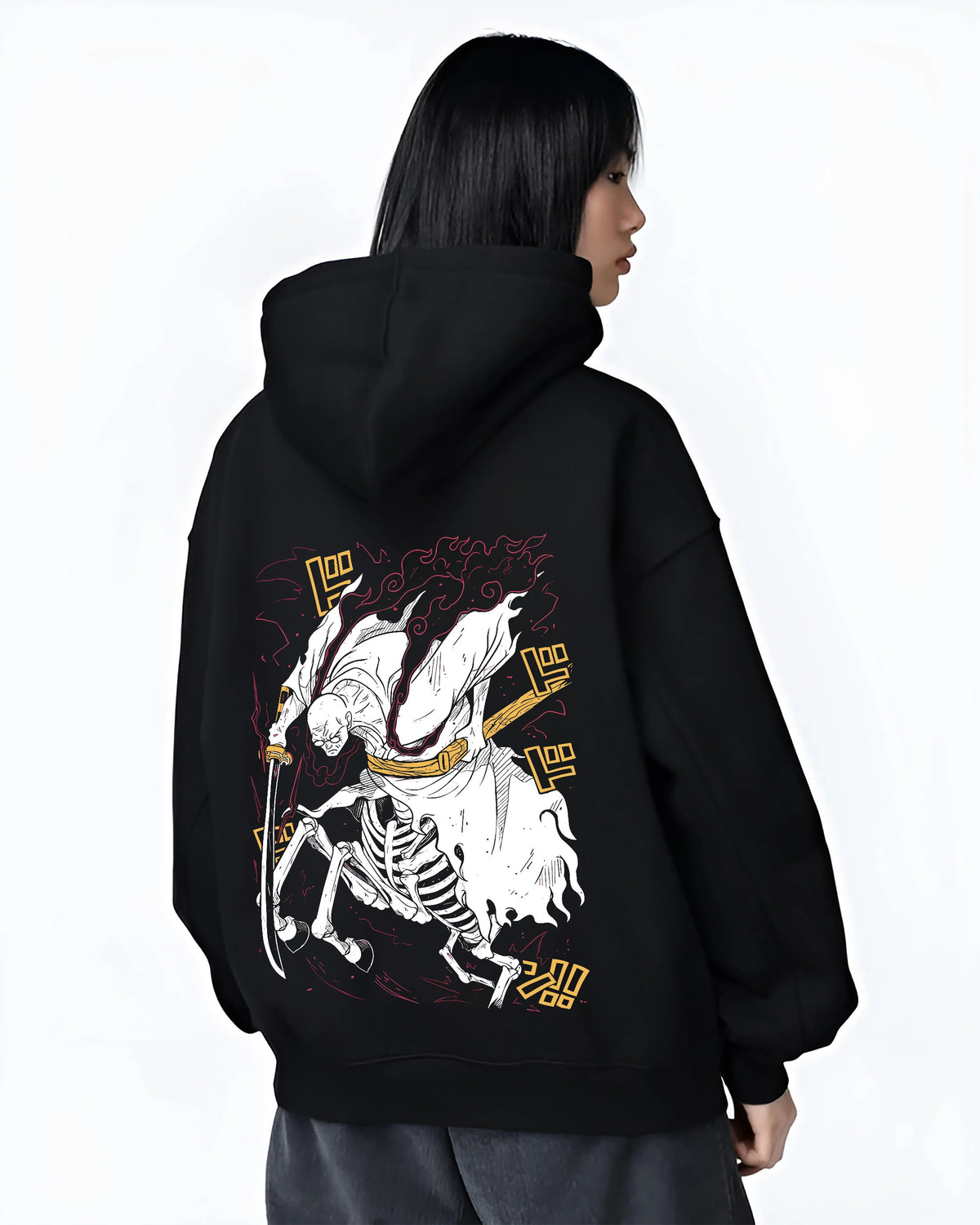 Black hoodie female model back view with Stylised skeleton swordsman with three swords from One Piece illustrated back