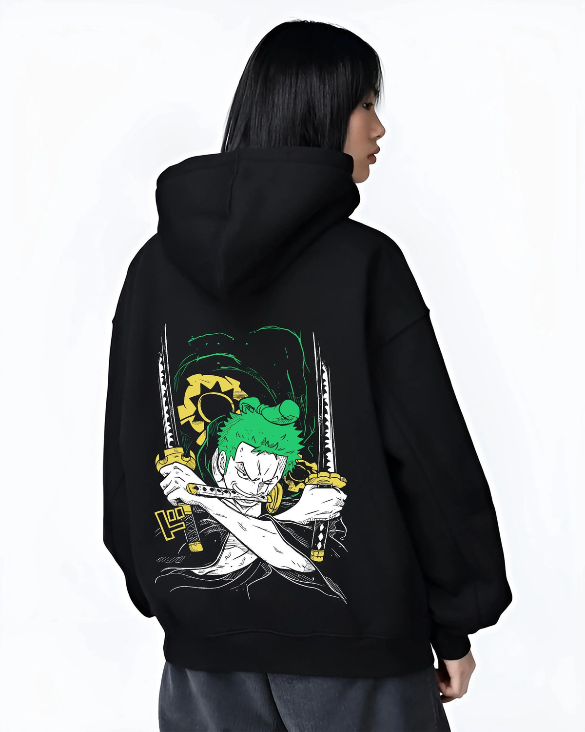 Black hoodie worn by female model from the back featuring Roronoa Zoro Santoryu green sword One Piece artwork.