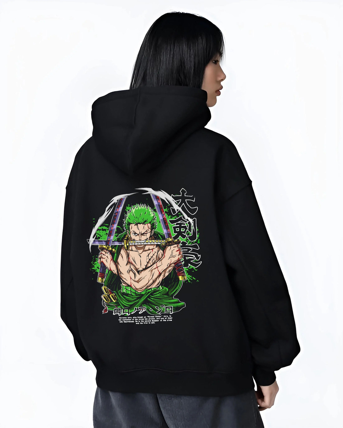 Black hoodie worn by female model from the back featuring Roronoa Zoro bandana Three Sword Style One Piece artwork.