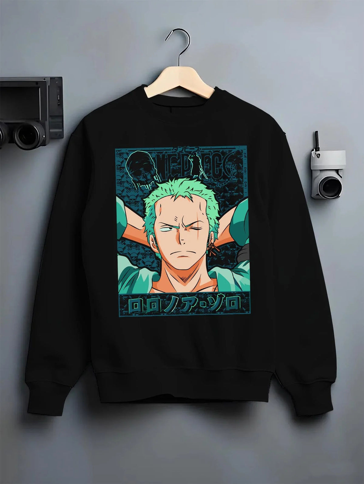 Black crewneck sweatshirt on hanger featuring Roronoa Zoro green hair swordsman One Piece artwork.