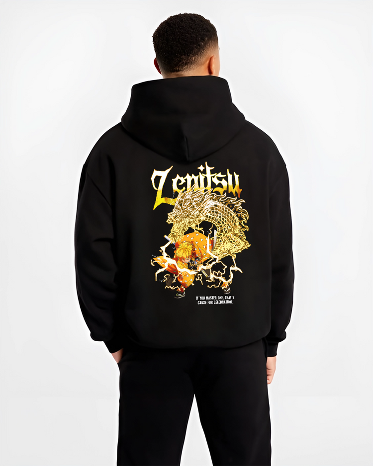 Black hoodie worn by a male model, back view, featuring Demon Slayer Zenitsu shonen battle character artwork with Japanese animation streetwear graphic in retro manga style.