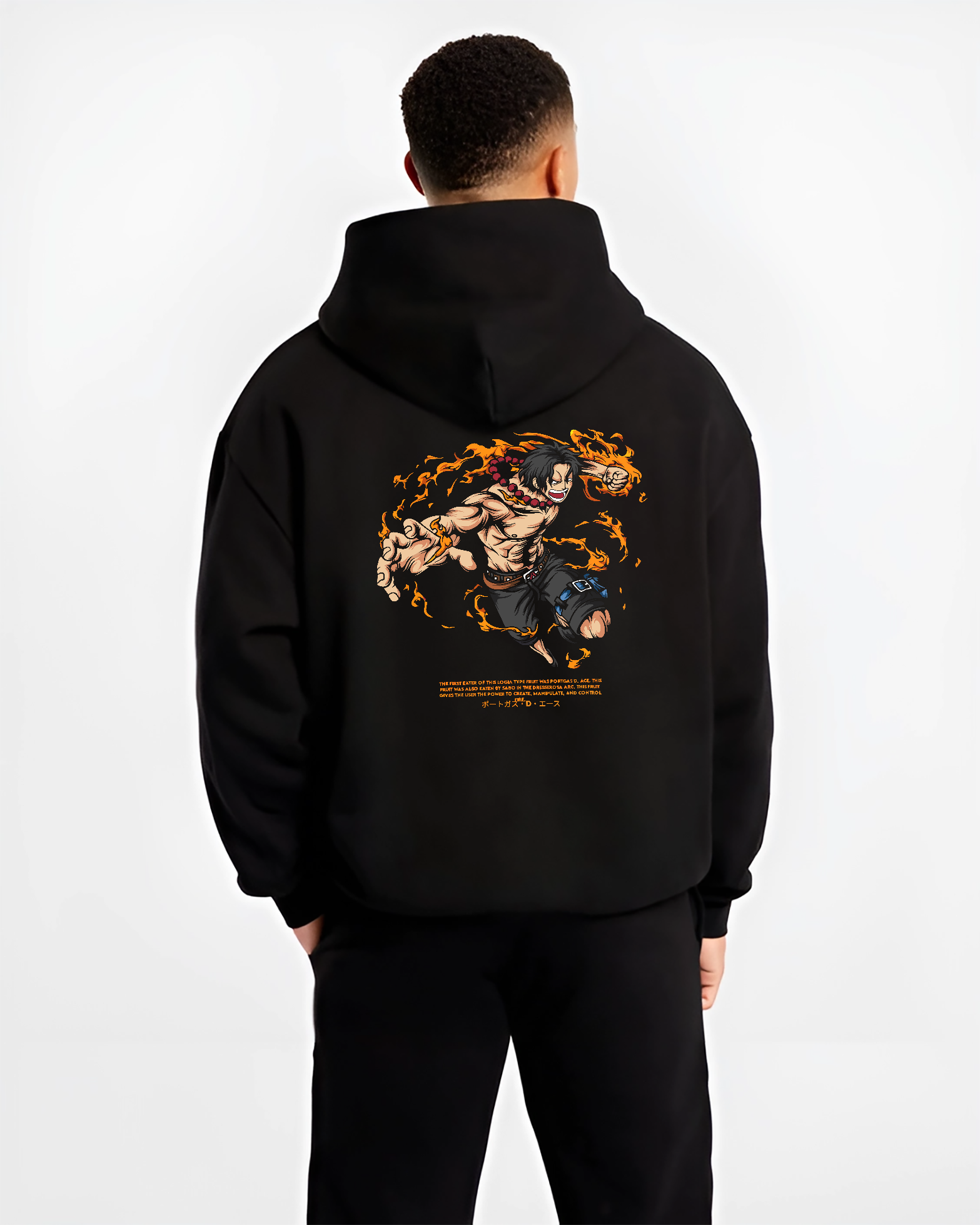 Black hoodie worn by a male model, back view, featuring Portgas D. Ace shonen battle character artwork with fiery anime poster inspired design from One Piece.