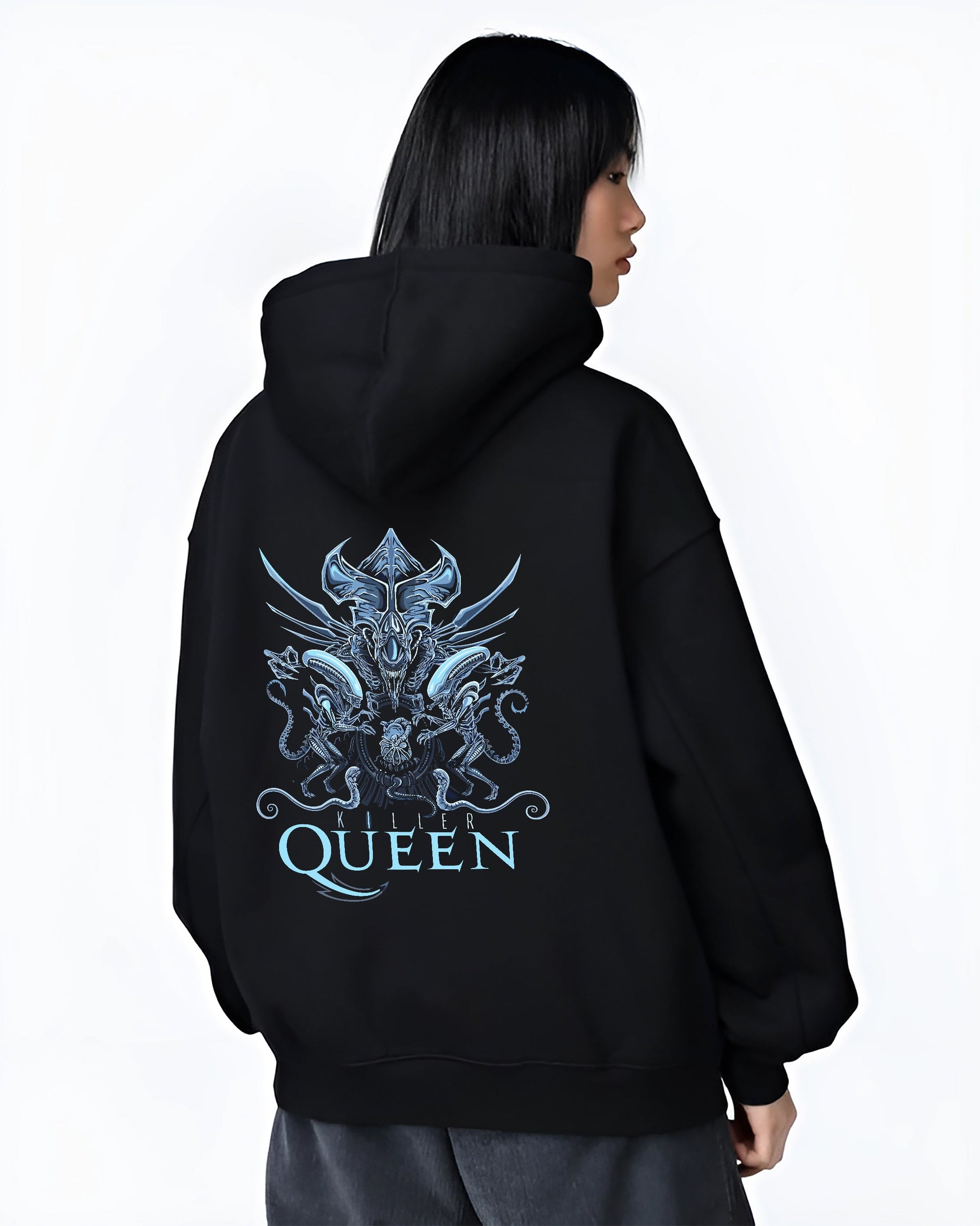 Black hoodie on female model, back view, Alien Xenomorph Queen “Killer Queen” retro sci-fi artwork with detailed biomech lines and icy blue accents.