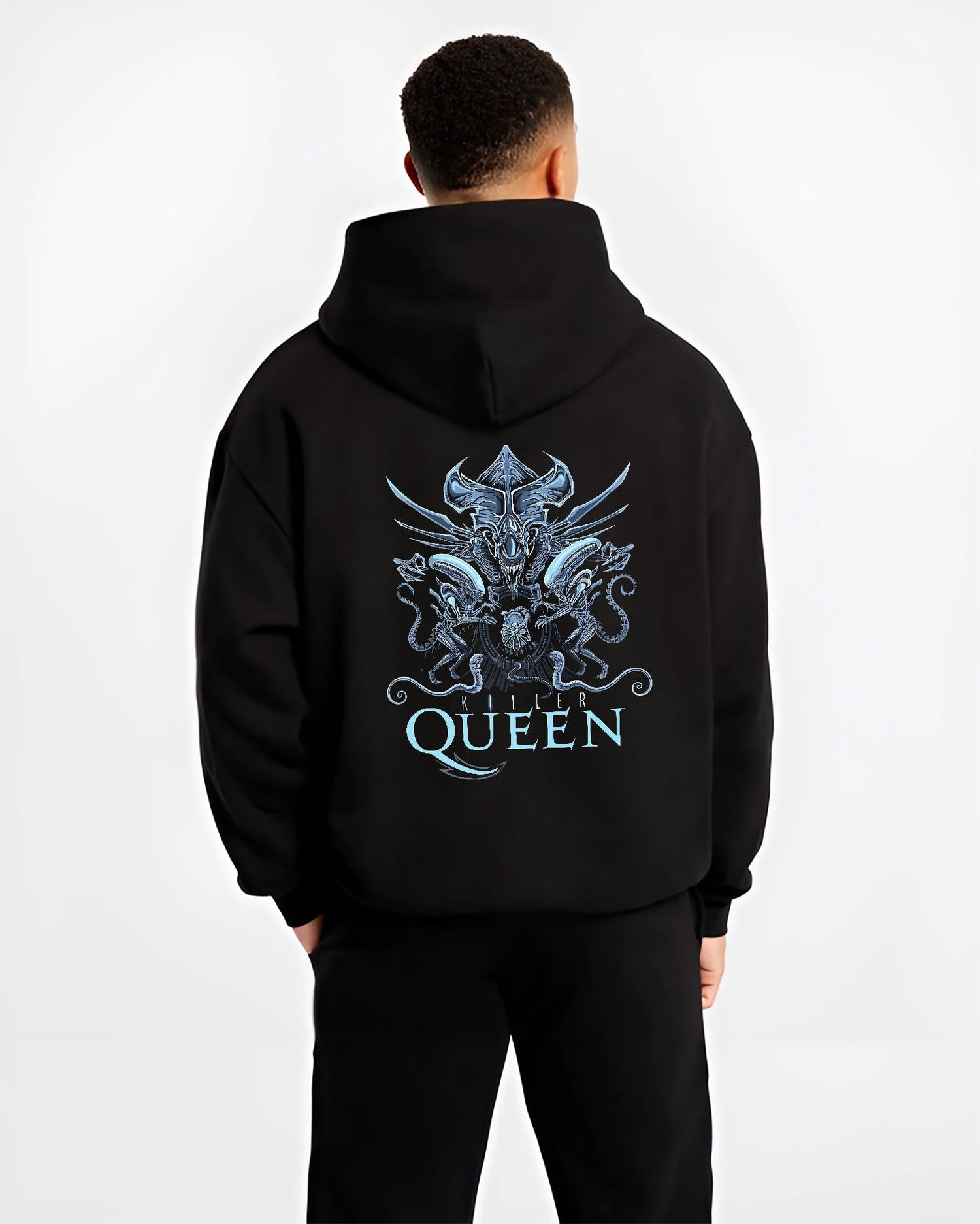 Black hoodie on male model, back view, Alien Xenomorph Queen “Killer Queen” retro sci-fi graphic with ornate biomechanical motifs and blue tones.