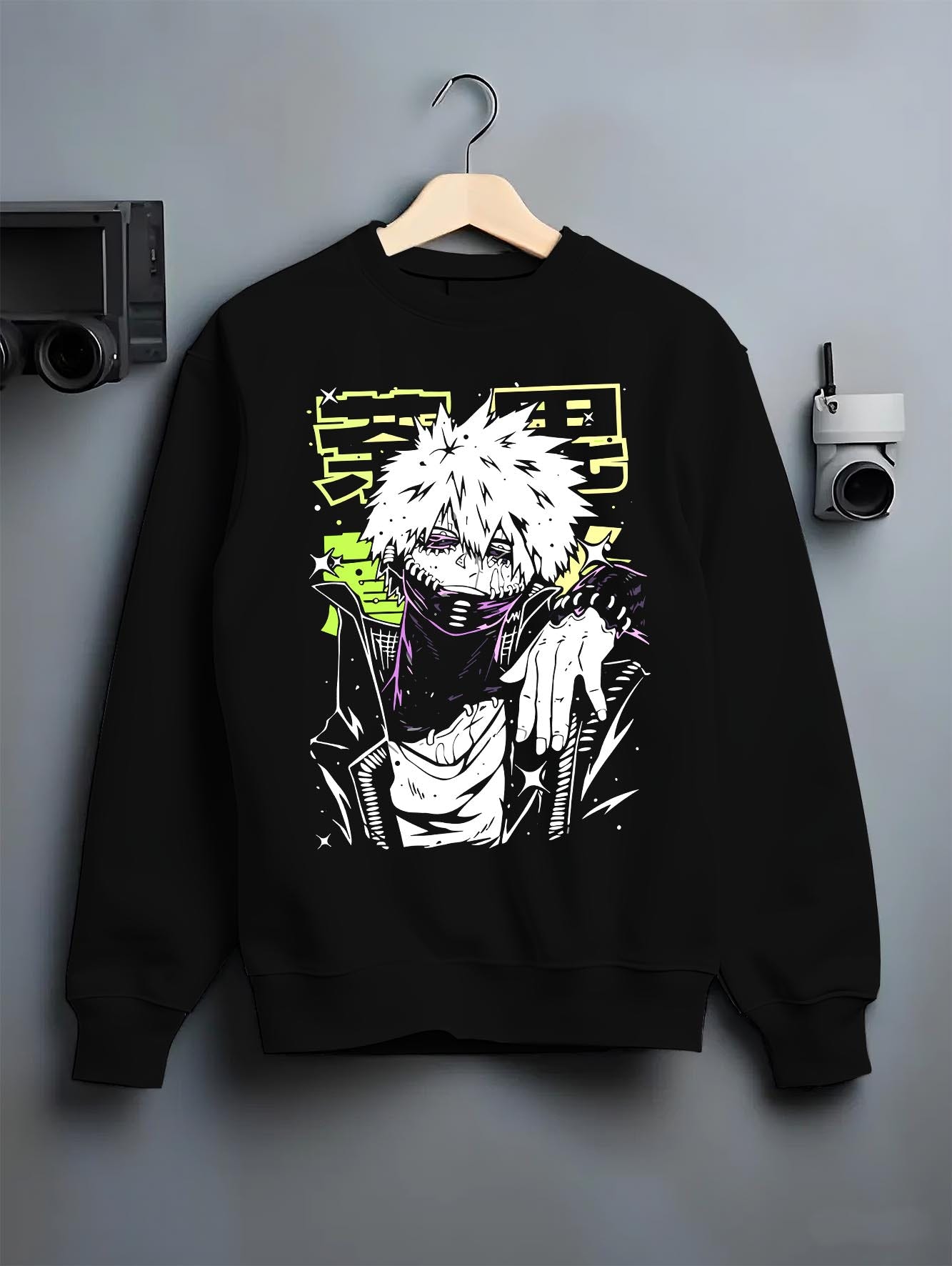 Black crewneck sweatshirt on a hanger against a grey wall, featuring Dabi My Hero Academia retro streetwear graphic with villain stance and neon manga panel styling.