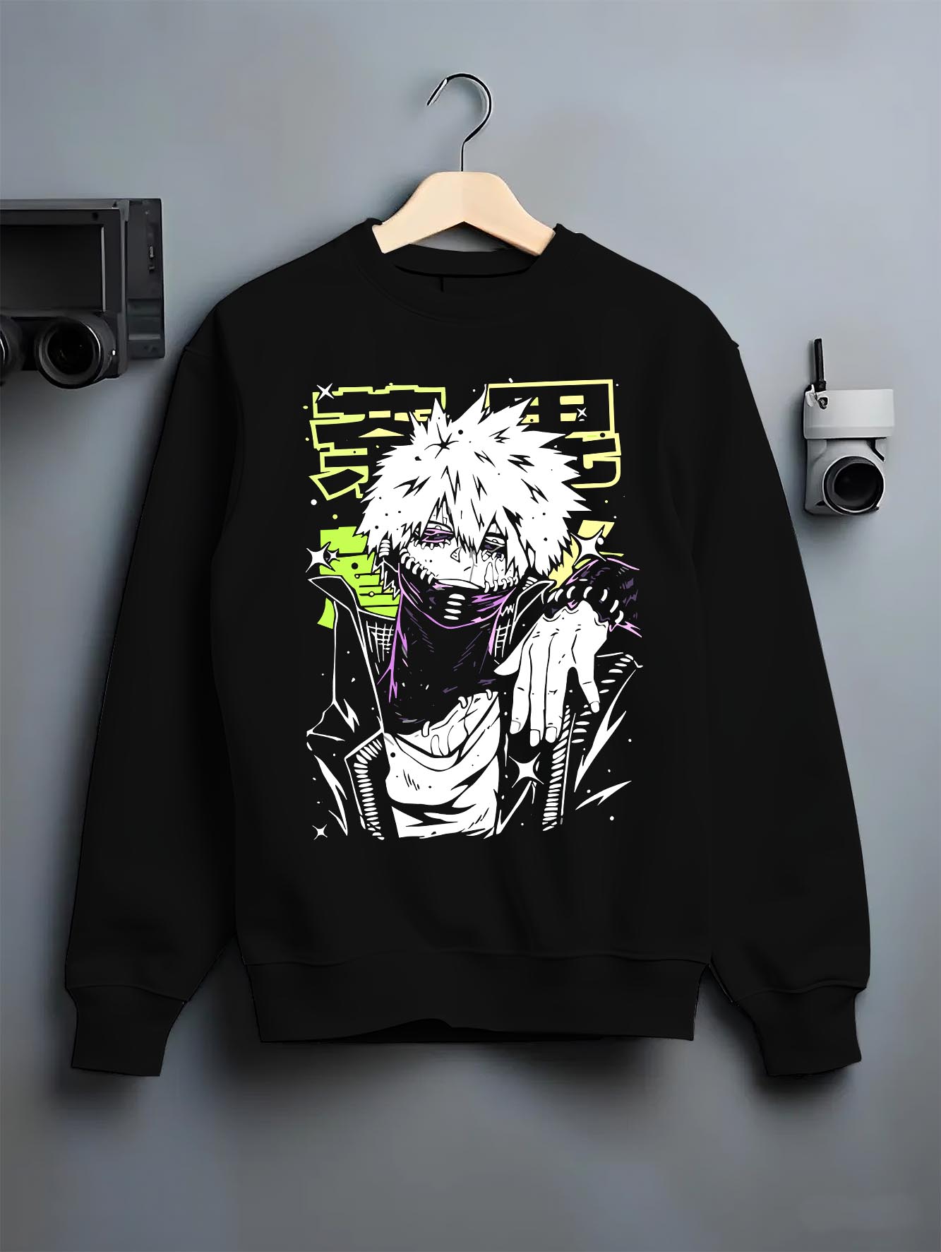 Black crewneck sweatshirt on a hanger against a grey wall, featuring Dabi My Hero Academia retro streetwear graphic with villain stance and neon manga panel styling.