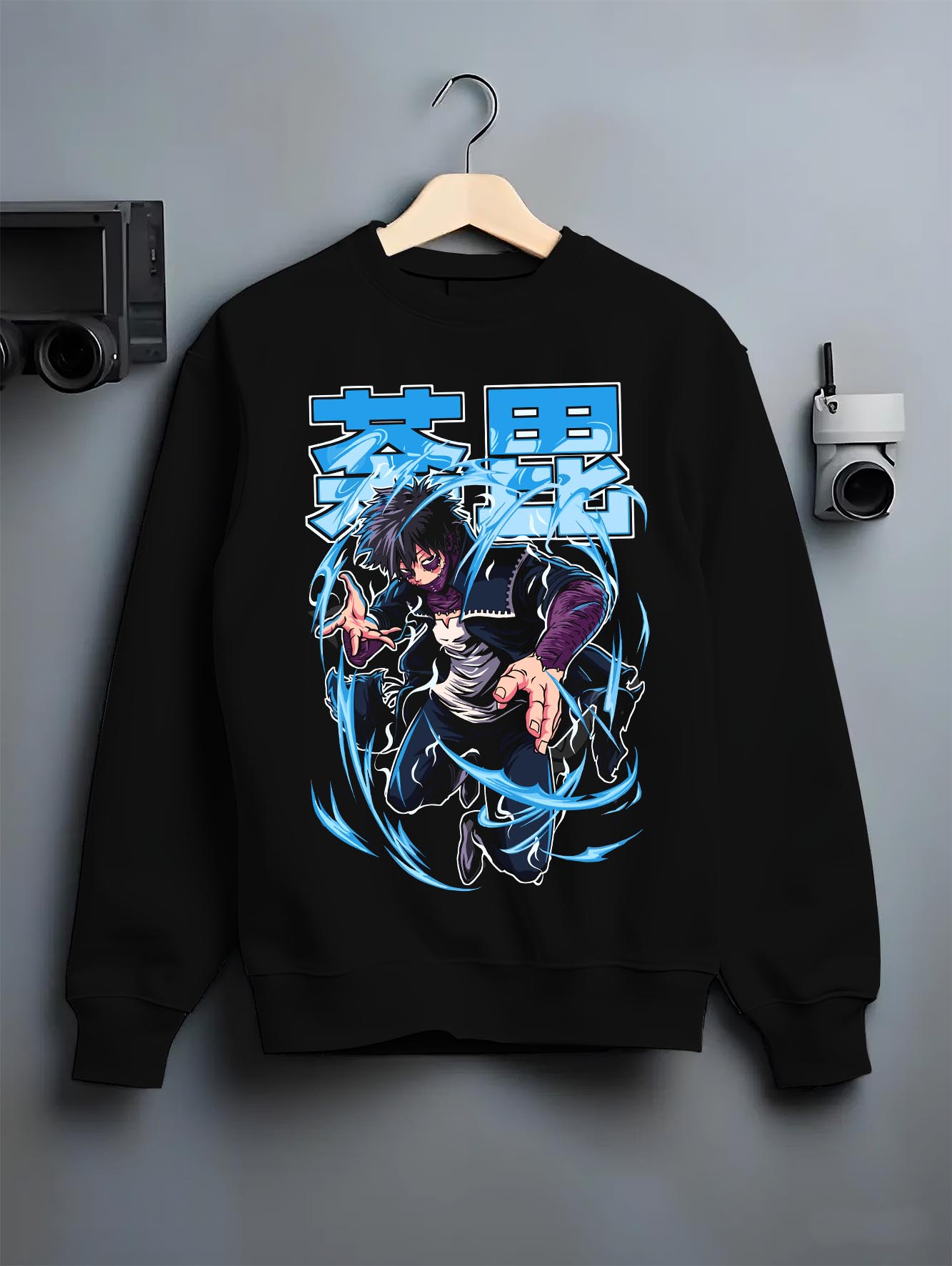 Black crewneck sweatshirt on a hanger against a grey wall, featuring Dabi My Hero Academia retro streetwear graphic with glowing flame aura in dark manga inspired style.