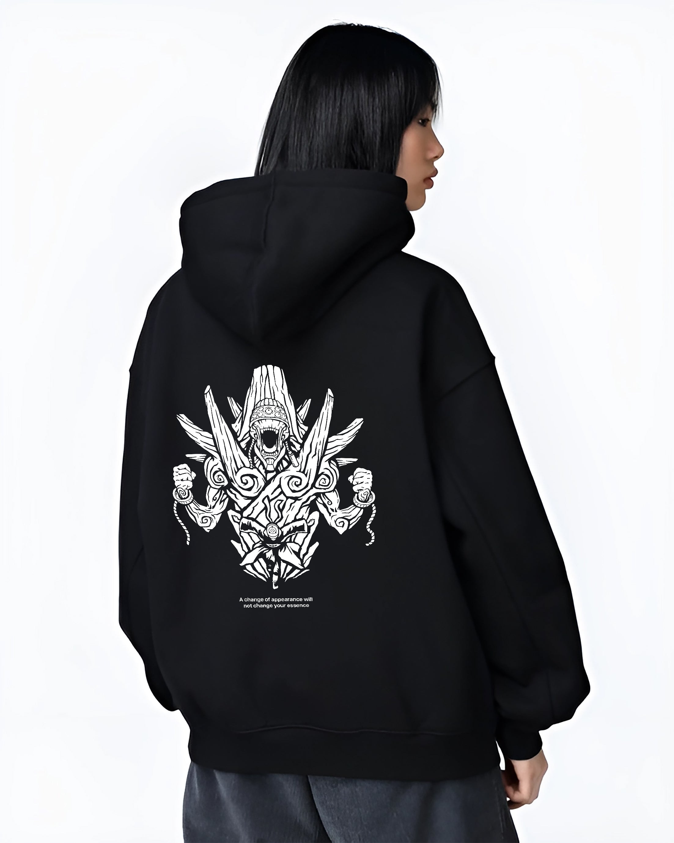 Black hoodie on female model, back view, featuring minimalist streetwear demon guardian line-art graphic with swirling shrine motifs and bold outlines.