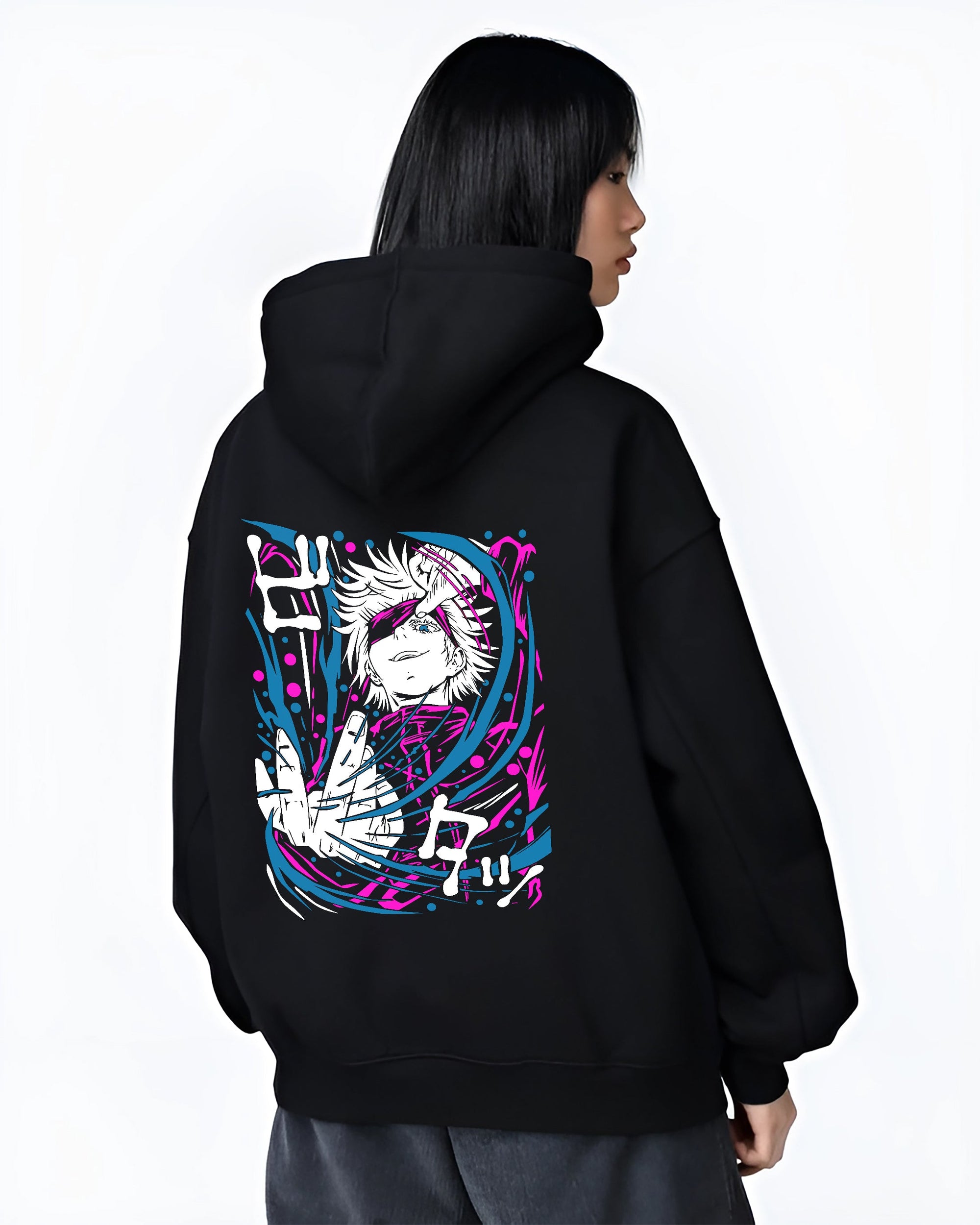 Black hoodie on female model, back view, featuring Gojo retro manga graphic with bold pink and cyan energy ribbons.