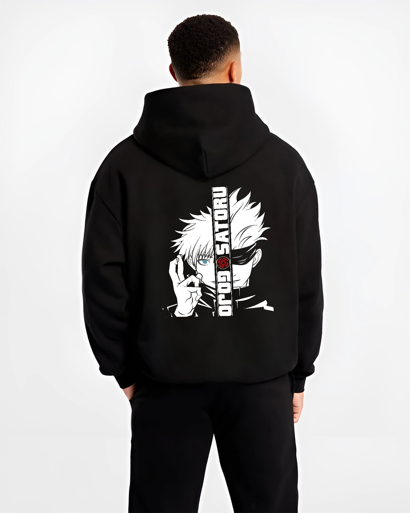 Black hoodie on male model, back view, featuring Gojo Satoru split portrait retro manga graphic with blue eye and urban streetwear flair.