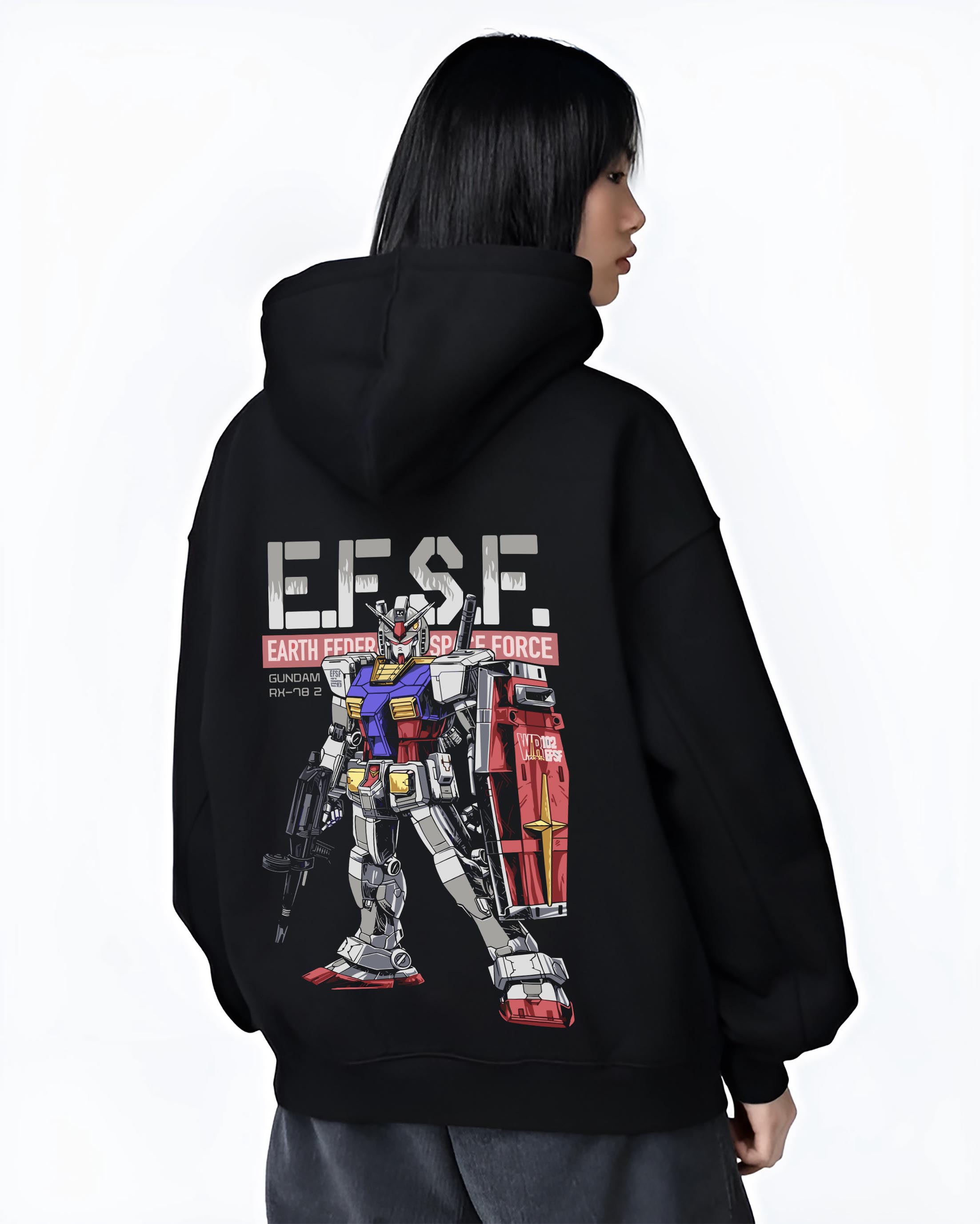 Black hoodie on female model, back view, showing Gundam RX-78-2 retro manga graphic with EFSF typography, red shield, and rifle.