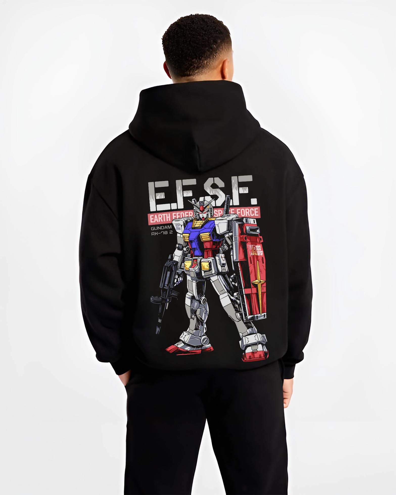 Black hoodie on male model, back view, featuring Gundam RX-78-2 Japanese animation streetwear design with EFSF text, shield, and rifle.