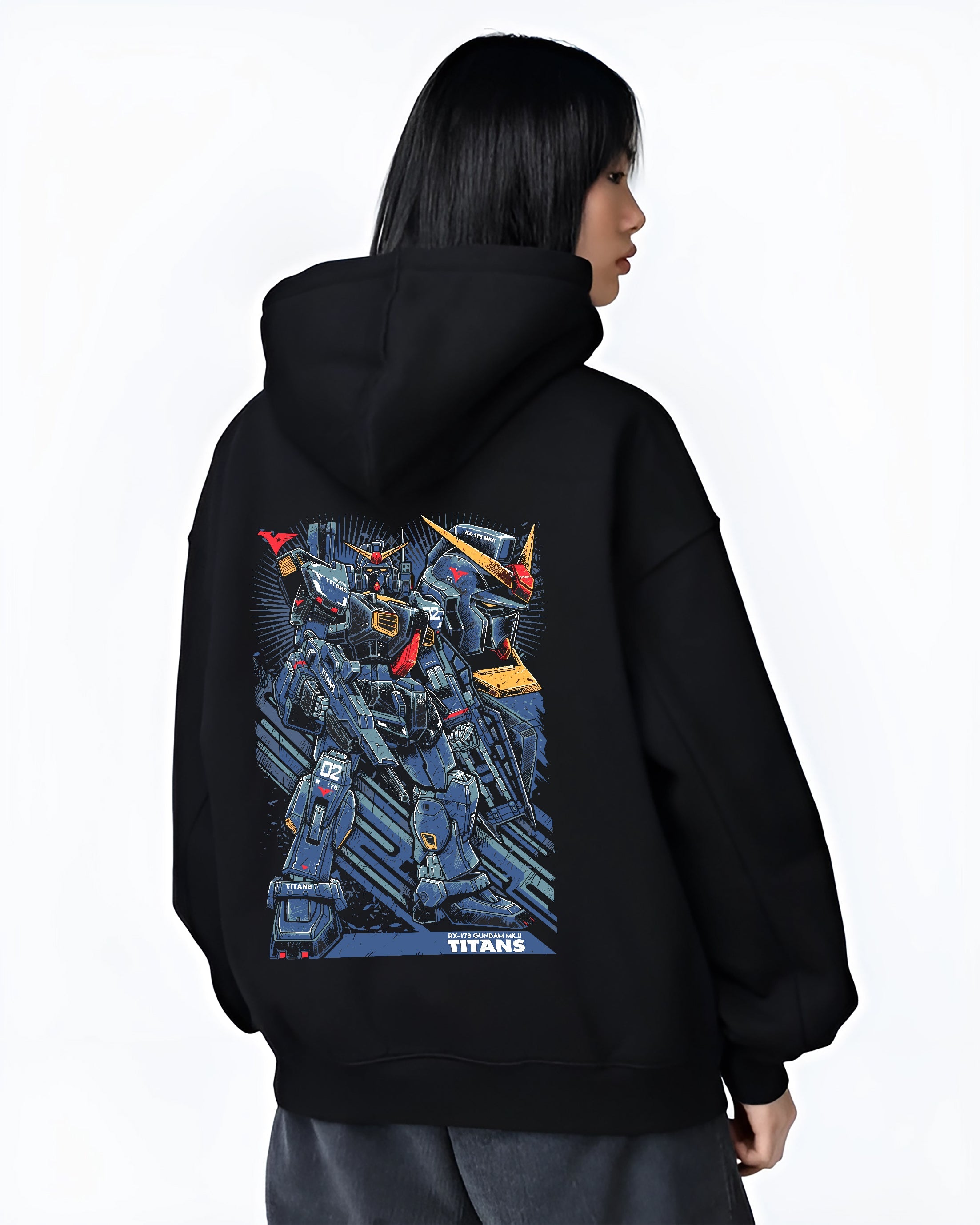 Black hoodie worn by a female model, back view, featuring Gundam Titans anime poster inspired artwork with retro mecha design and striking urban fashion back graphic.