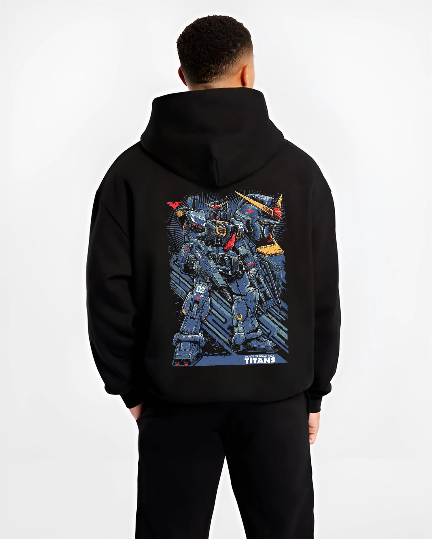 Black hoodie worn by a male model, back view, featuring Gundam Titans retro manga inspired design with giant mecha suit in Japanese animation streetwear style.