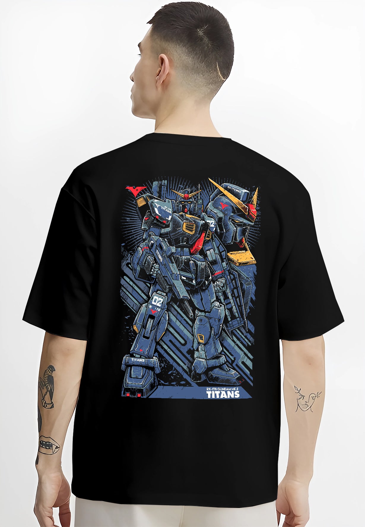 Black T-shirt worn by a male model, back view, featuring Gundam Titans retro manga panel mecha artwork with mechanical battle suit in anime streetwear aesthetic.