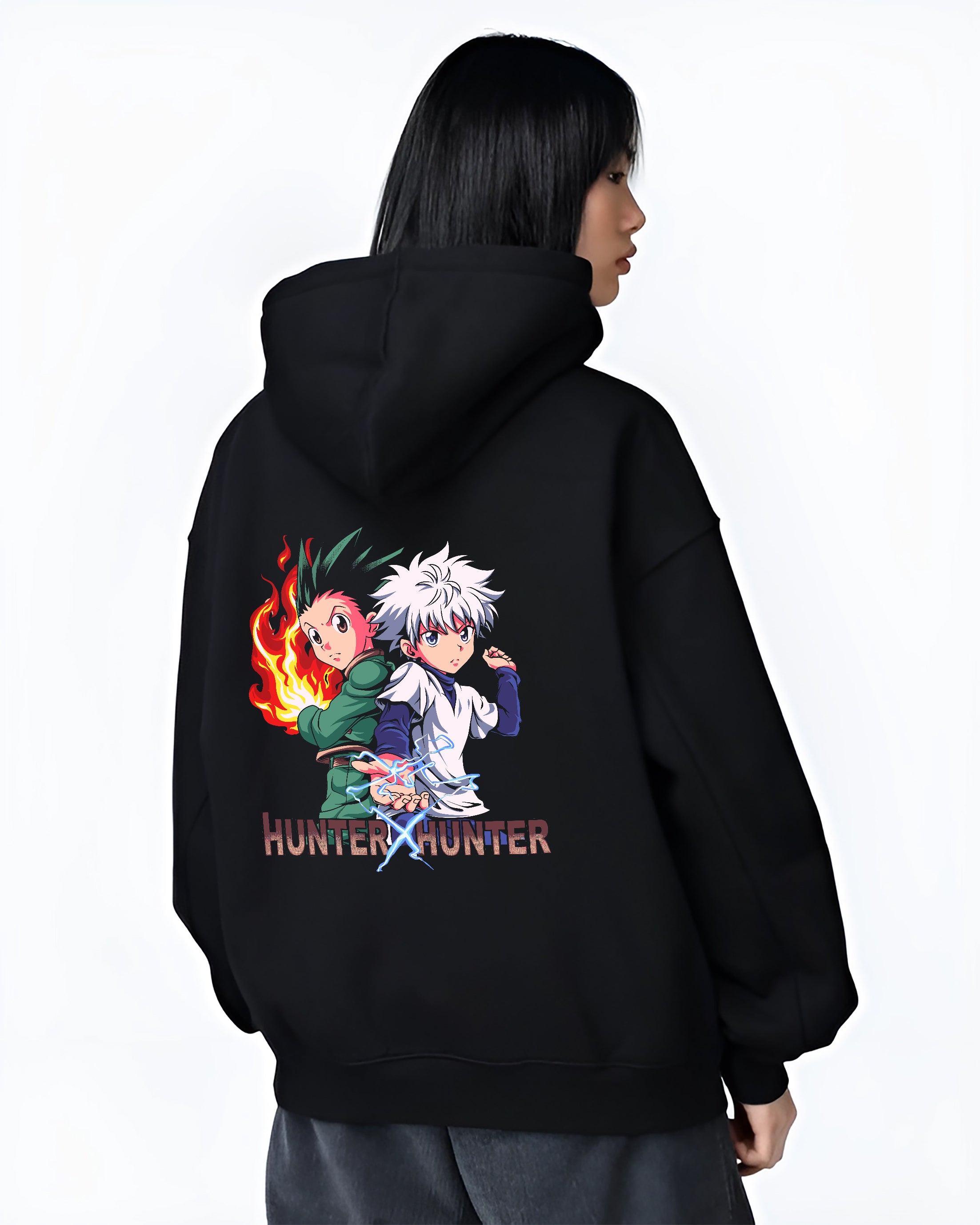 Black hoodie on female model, back view, Gon and Killua Hunter x Hunter retro manga graphic with pink glow and lightning aura.