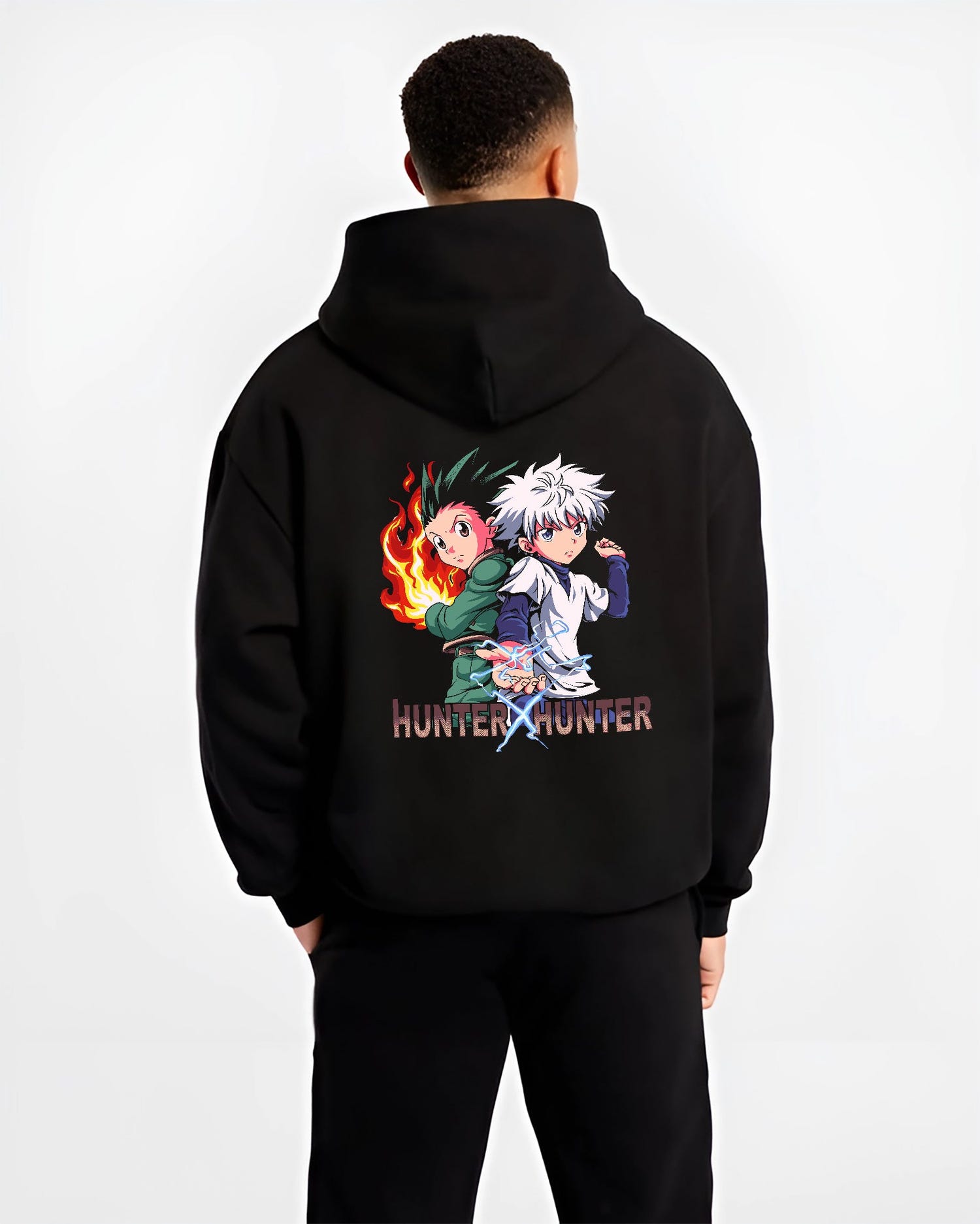 Black hoodie on male model, back view, Hunter x Hunter Gon and Killua anime poster design with pixel art flames and lightning.