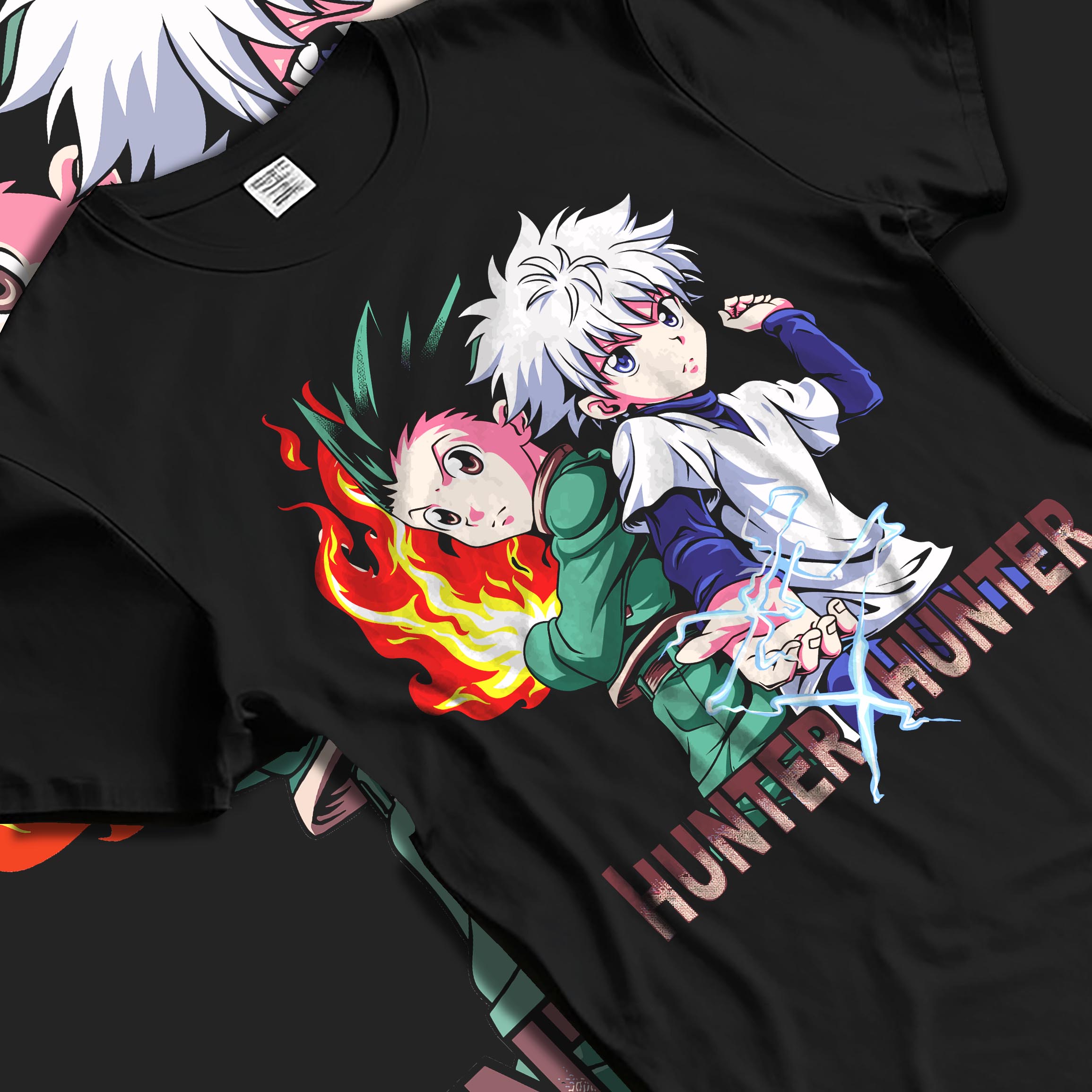 Black T-shirt laid flat with soft folds, featuring Hunter x Hunter Gon and Killua nostalgic 90s pixel manga artwork.