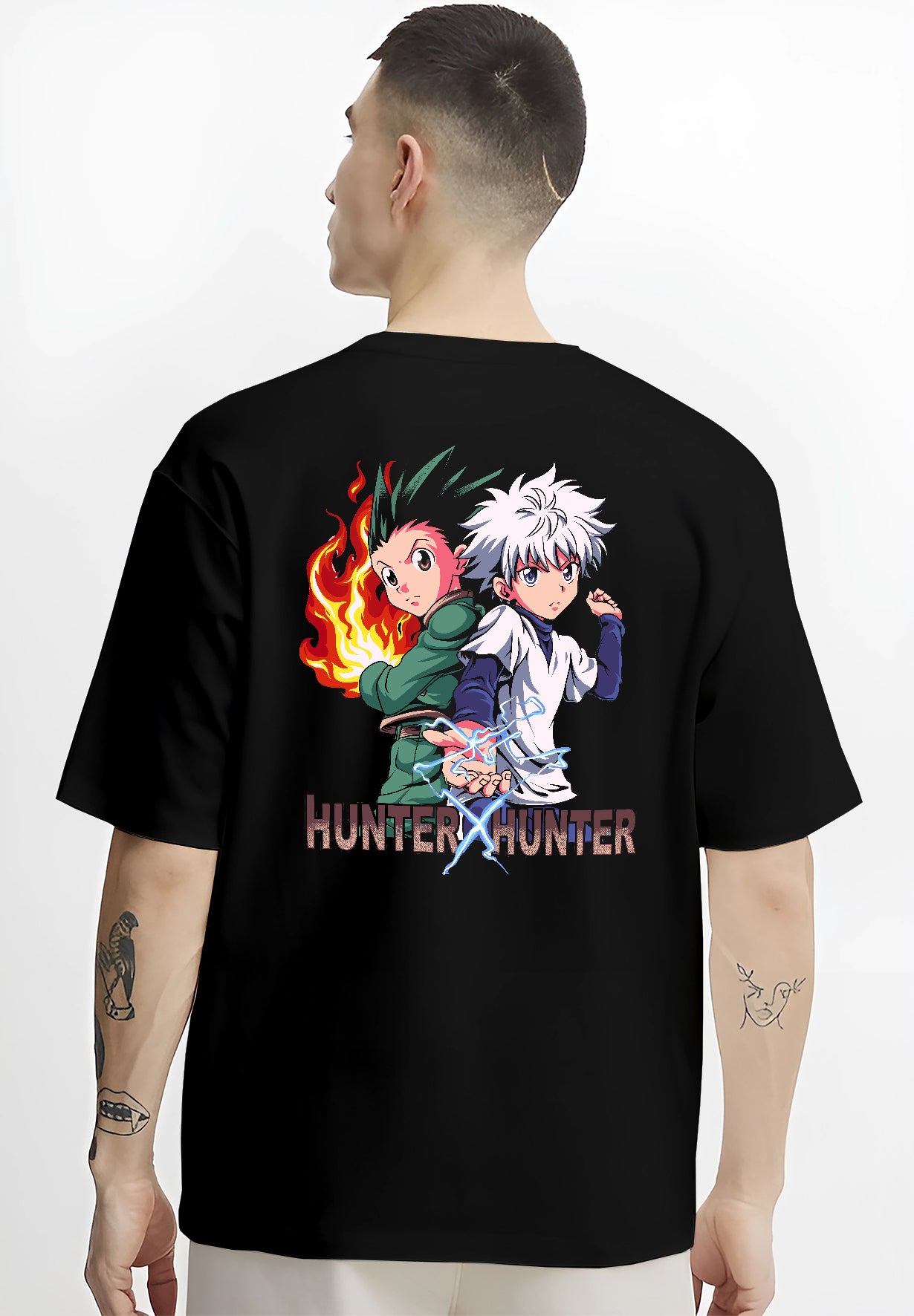 Black T-shirt on male model, back view, Gon and Killua Hunter x Hunter retro video game graphic with flame and lightning details.