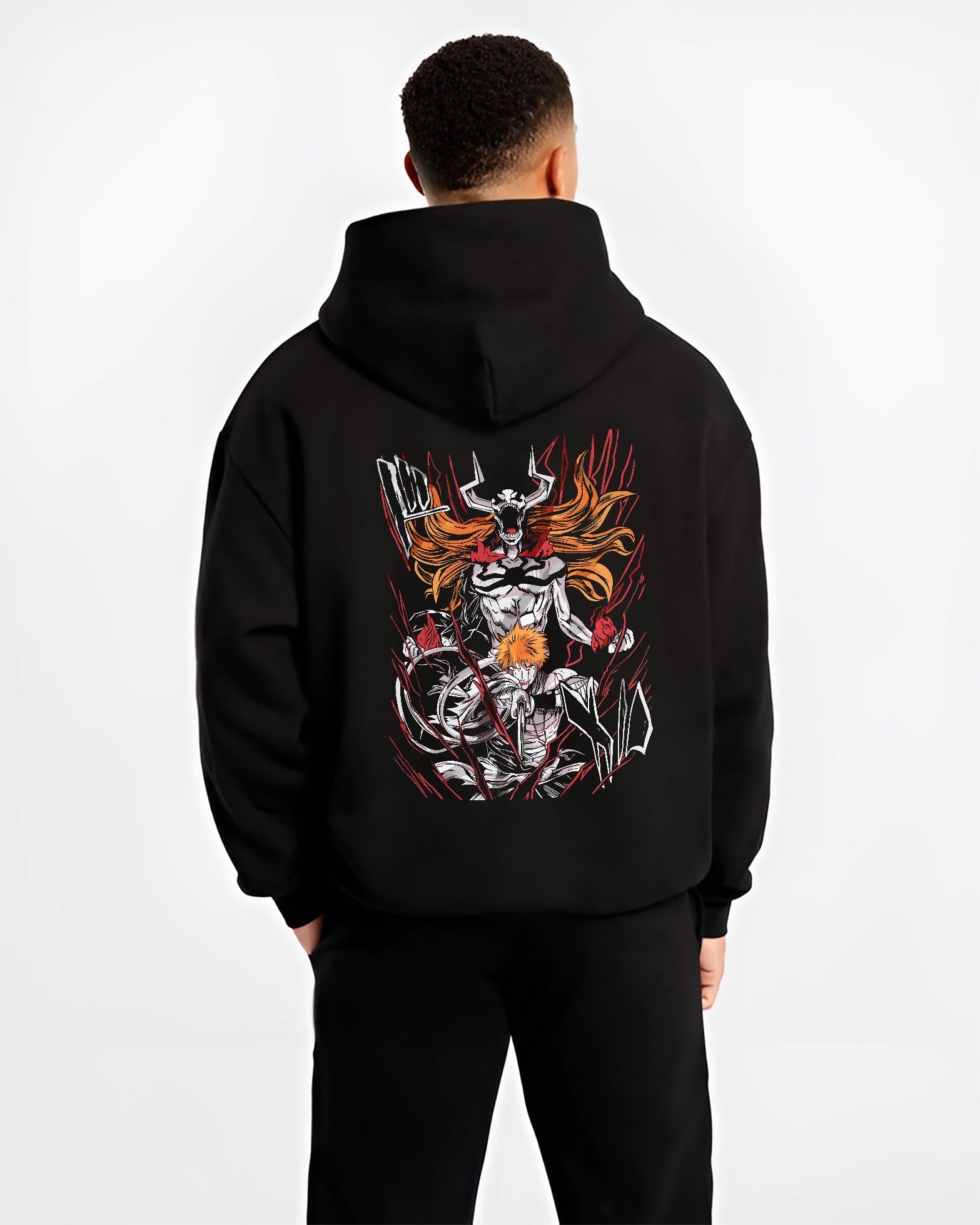 Black hoodie worn by a male model, back view, featuring Ichigo Bleach shonen battle character artwork with hollow transformation aura in Japanese animation streetwear.