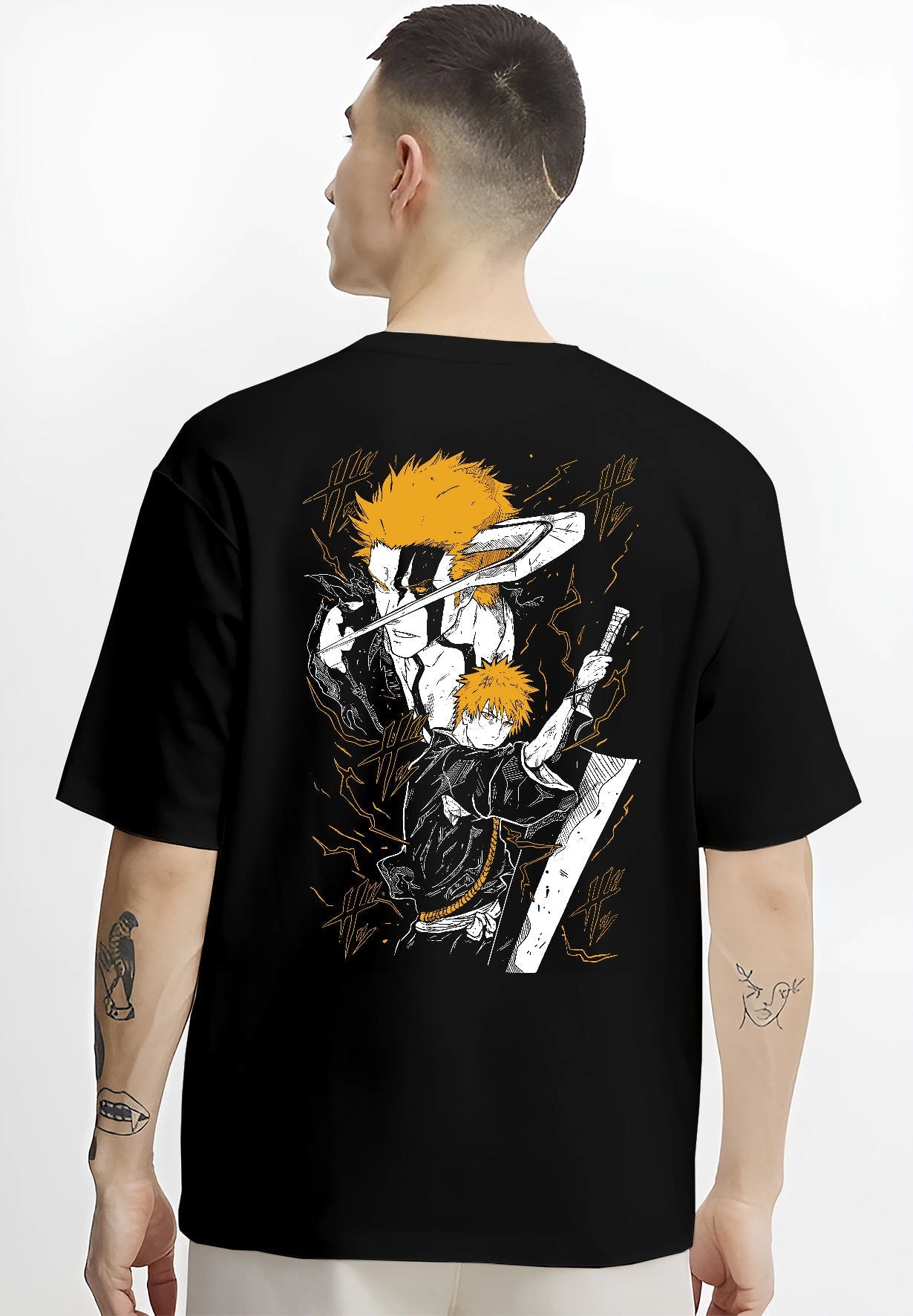 Black T-shirt worn by a male model, back view, featuring Ichigo Bleach anime poster inspired shonen battle design with bold sword stance in manga panel style.