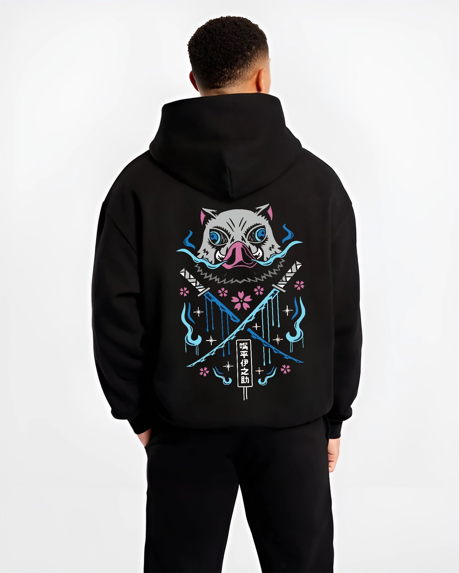 Black hoodie on male model, back view, featuring Inosuke boar mask retro manga graphic with crossed swords, blue flames, and sakura accents.