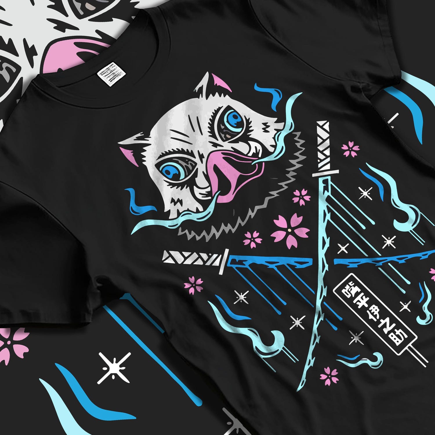 Black T-shirt laid flat with soft folds, featuring Inosuke Demon Slayer boar mask back graphic, crossed blades, blue flames, and blossoms.