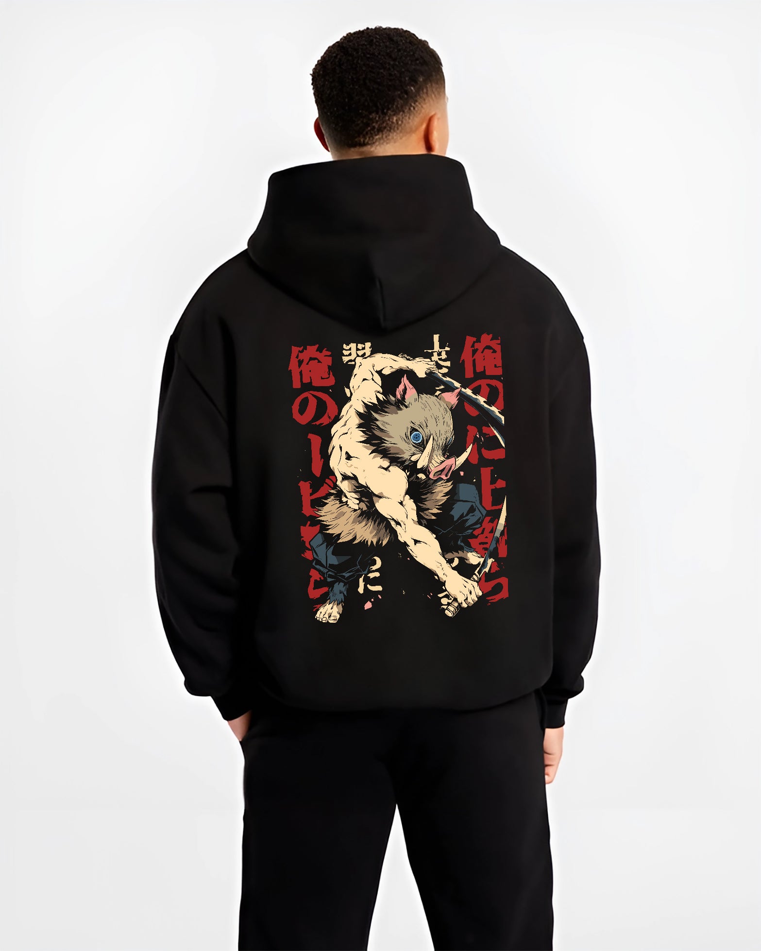 Black hoodie worn by a male model, back view, featuring Inosuke Demon Slayer retro manga inspired graphic with fierce boar mask warrior stance in anime streetwear.