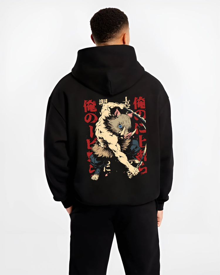 Black hoodie worn by a male model, back view, featuring Inosuke Demon Slayer retro manga inspired graphic with fierce boar mask warrior stance in anime streetwear.
