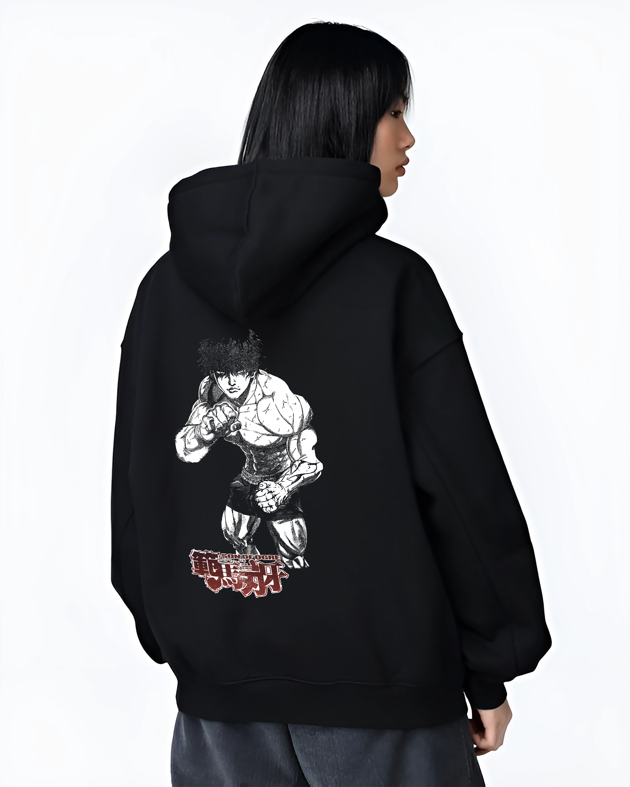 Black hoodie worn by a female model, back view, featuring Baki Hanma Son of Ogre Japanese animation inspired artwork design with dark manga panel style.