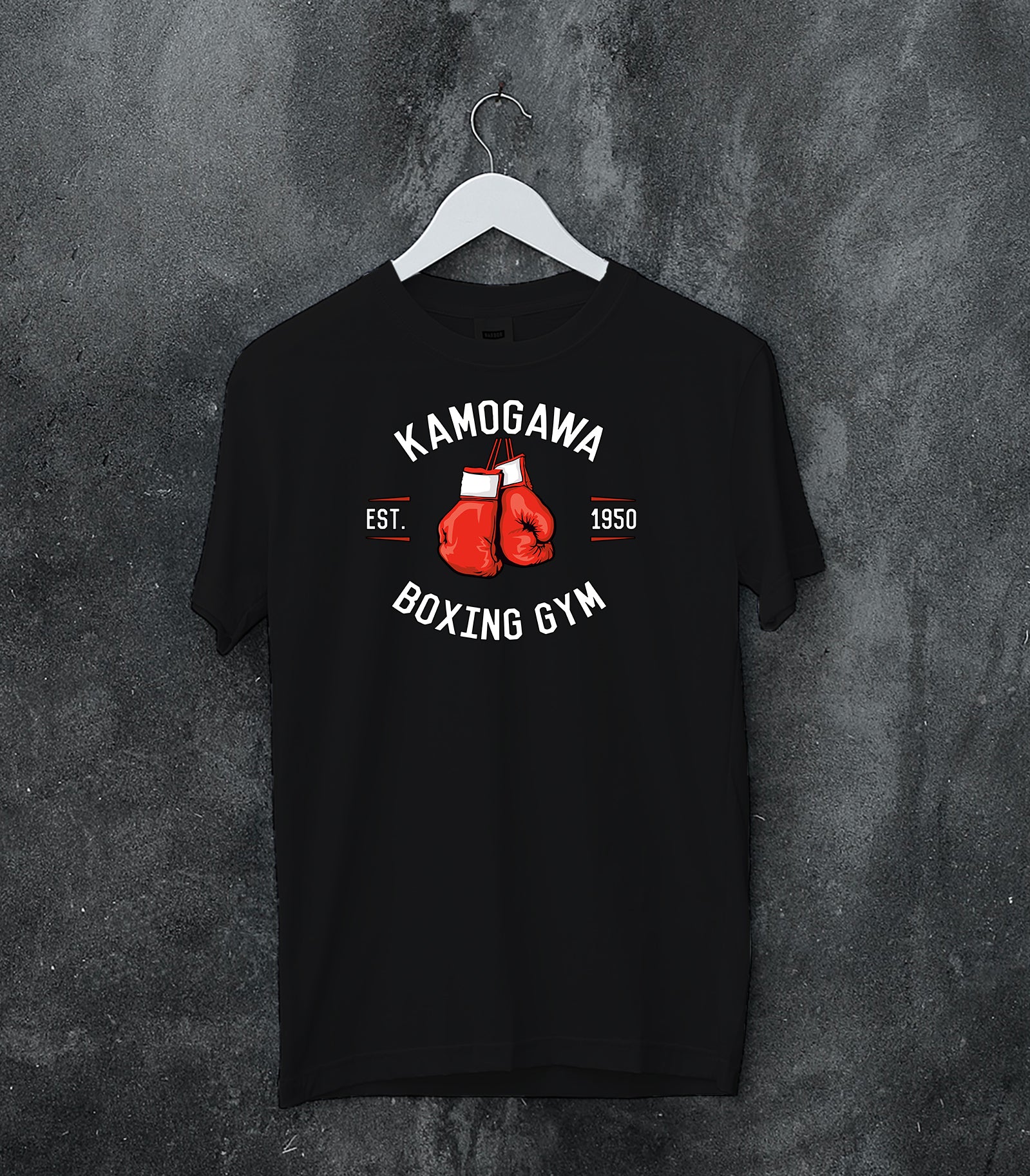 Black hoodie worn by a female model, back view, featuring Kamogawa Boxing Gym retro streetwear artwork with vintage boxing gloves and bold athletic gym lettering.