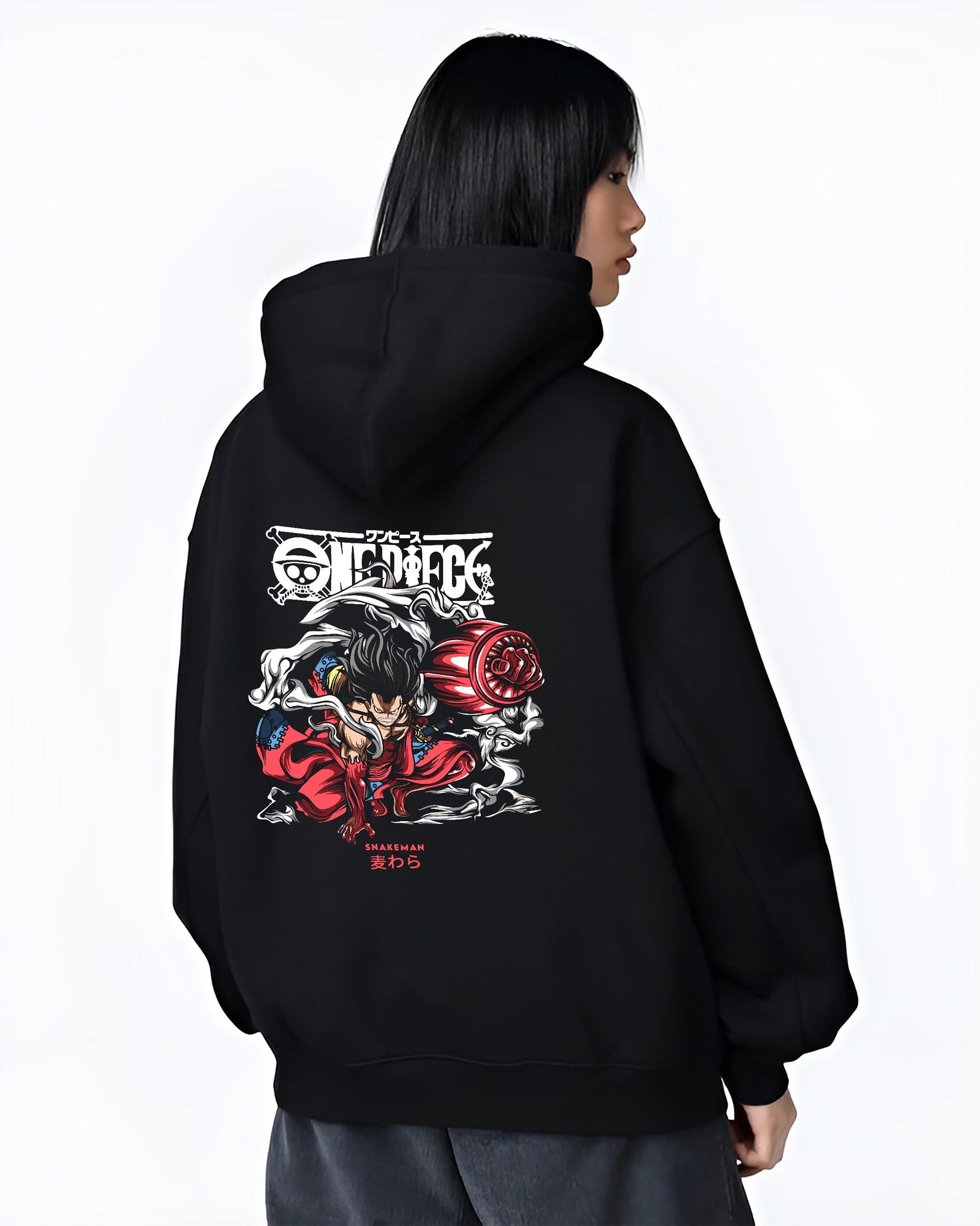 Black hoodie on female model, back view, featuring Luffy Snakeman Japanese animation streetwear graphic with smoke trails and bold red accents.