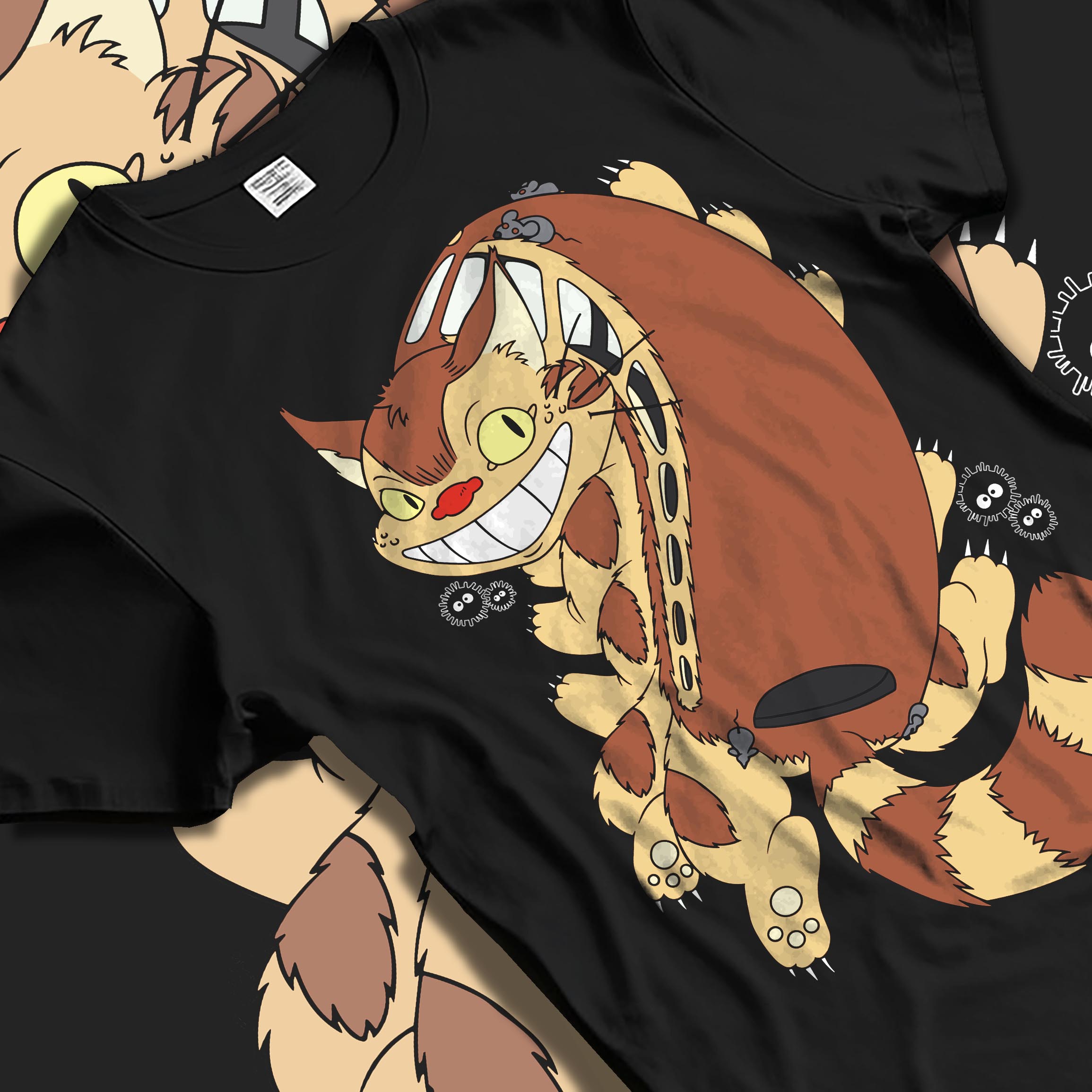 Black T-shirt laid flat with soft folds, featuring Totoro Catbus and soot sprites; anime poster inspired artwork with playful retro charm.