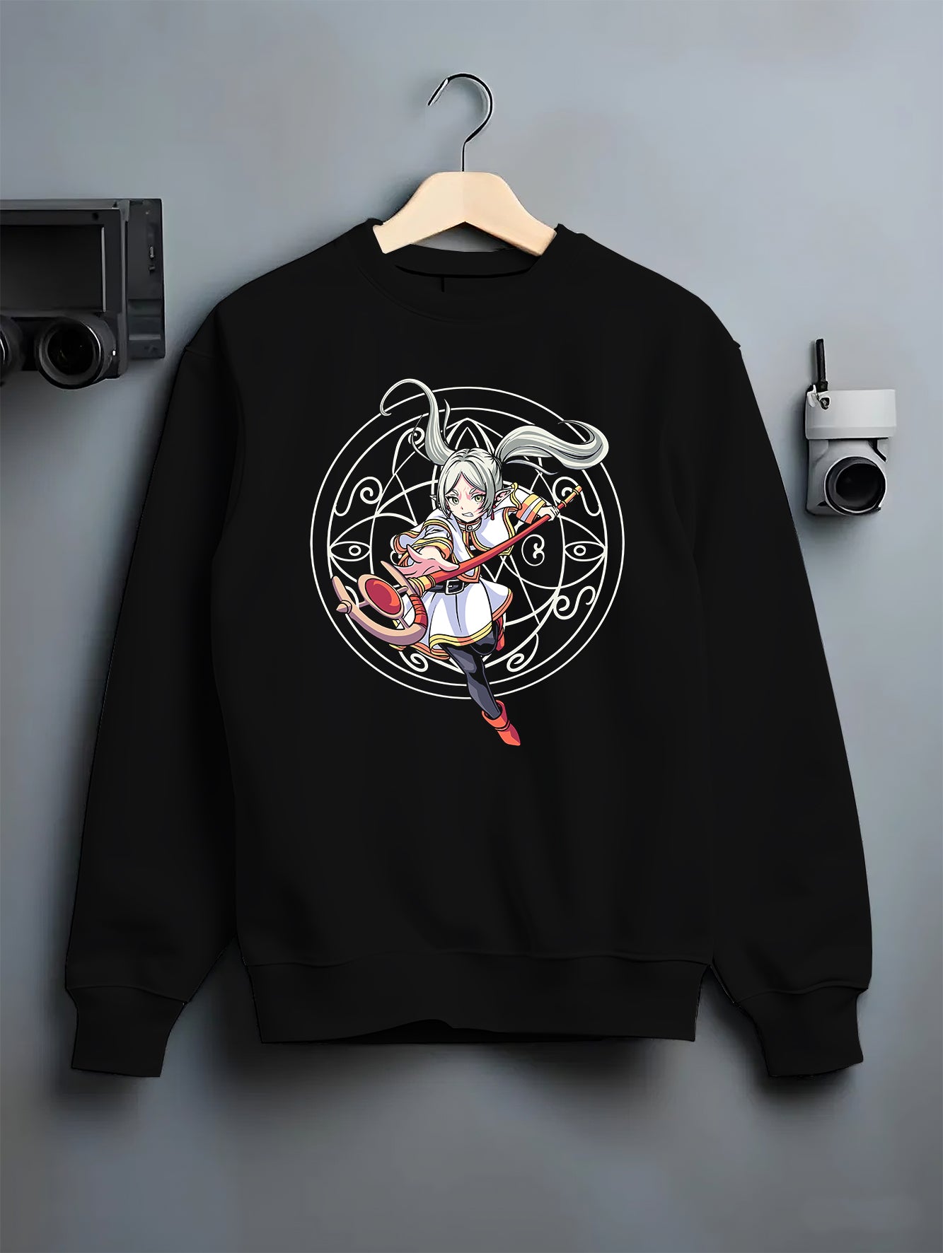 Black crewneck sweatshirt on hanger against grey wall, featuring Noelle Silva Black Clover magic circle back graphic.