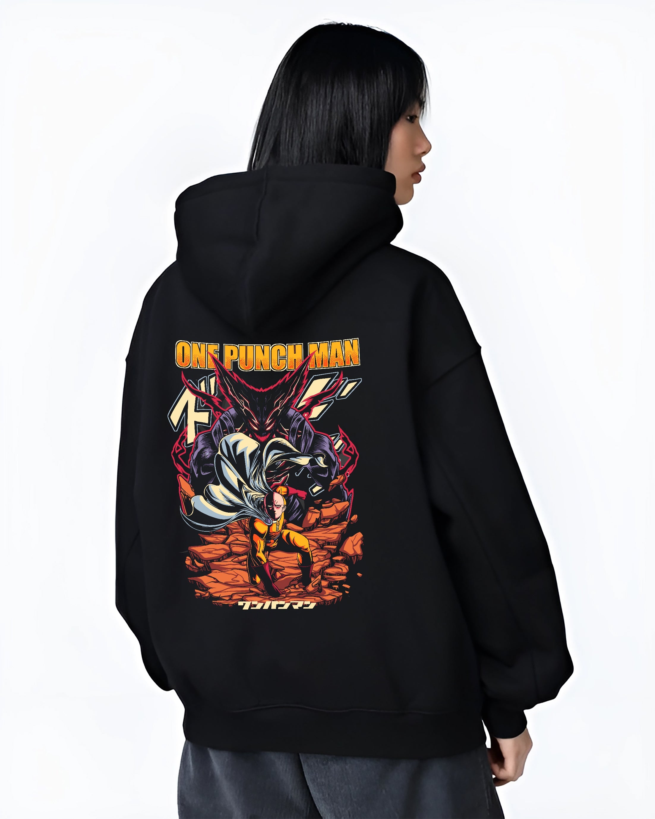 Black hoodie worn by a female model, back view, featuring One Punch Man anime poster inspired artwork with Saitama facing Garou in dramatic urban fashion design.