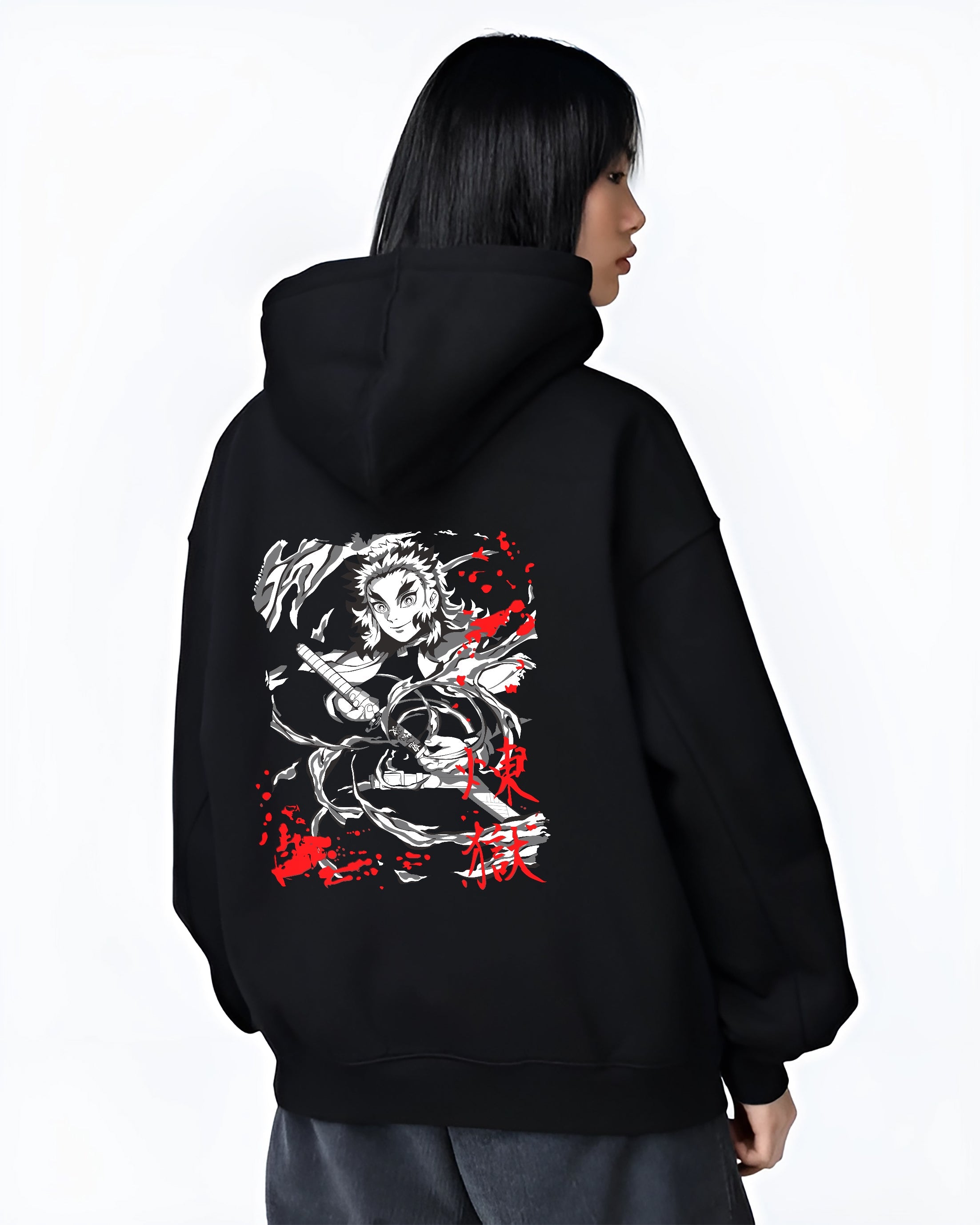 Black hoodie on female model, back view, featuring Rengoku Demon Slayer swirling flames retro manga graphic and modern streetwear.