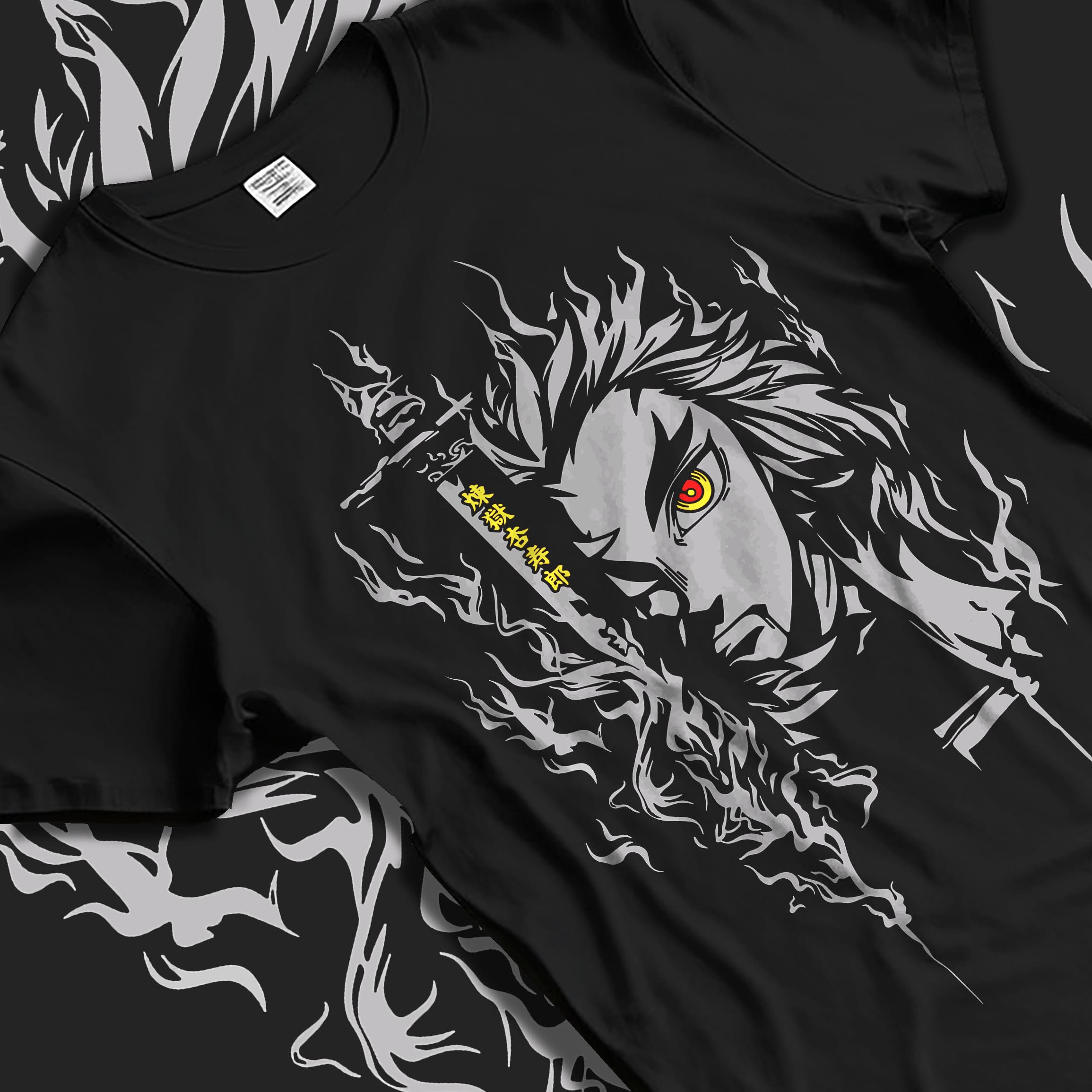 Black T-shirt laid flat with natural fabric folds, featuring Demon Slayer Rengoku anime poster inspired fiery portrait design with glowing red eye in manga graphic style.