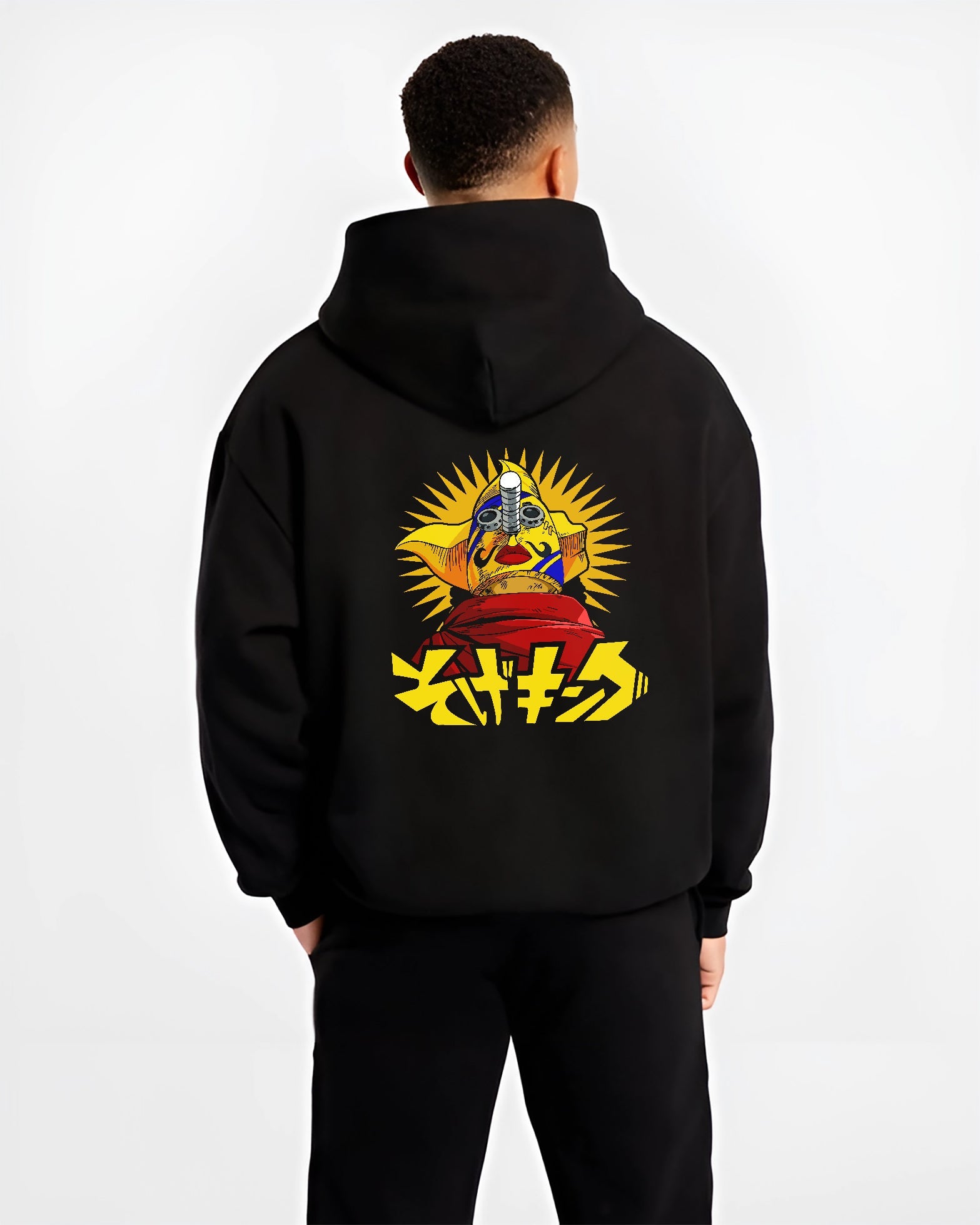 Black hoodie on male model, back view, featuring anime poster inspired masked idol graphic with sunburst rays and striking Japanese lettering.