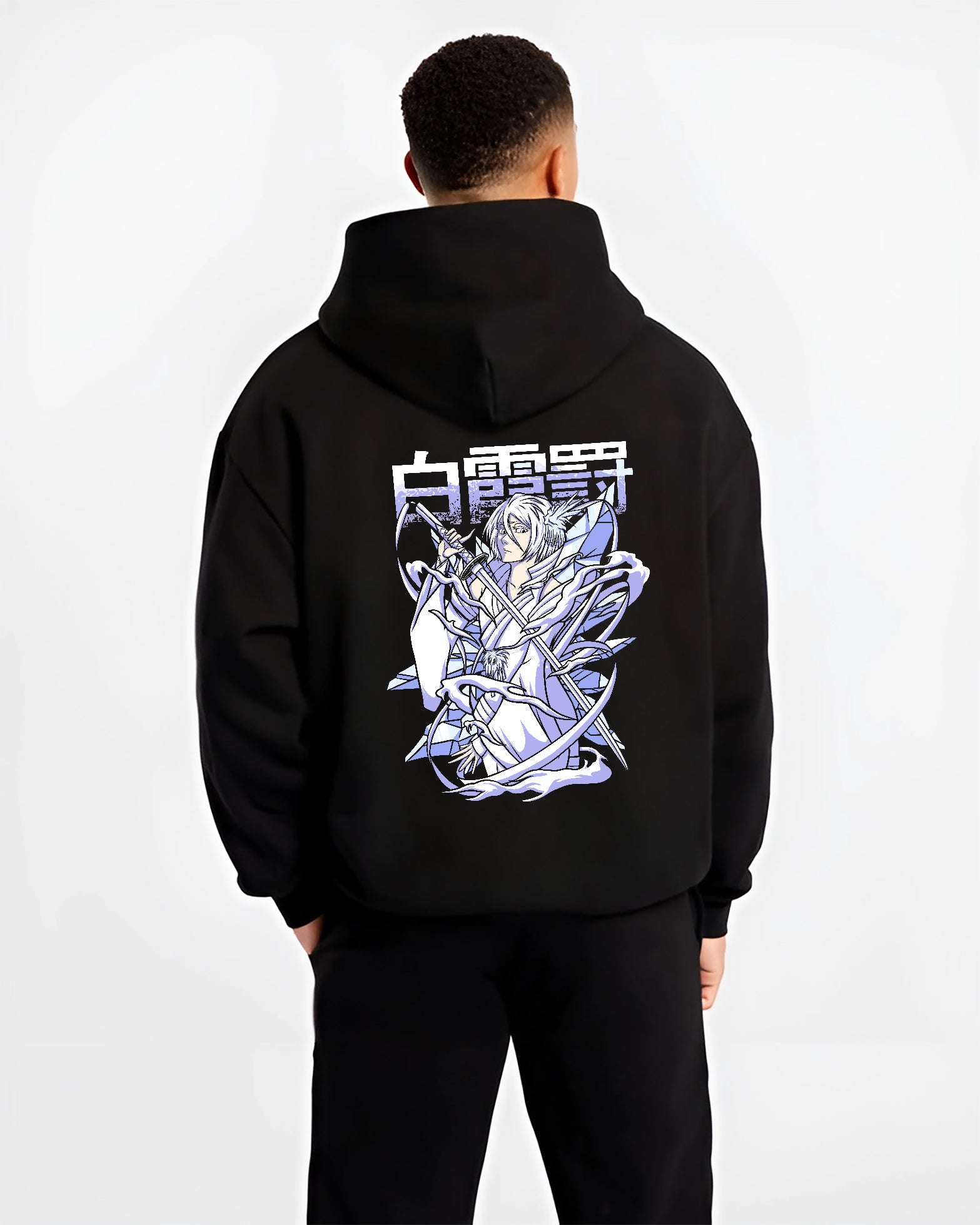 Black hoodie worn by a male model, back view, featuring Rukia Kuchiki Bleach Bankai Japanese animation streetwear design with frosty shonen battle artwo