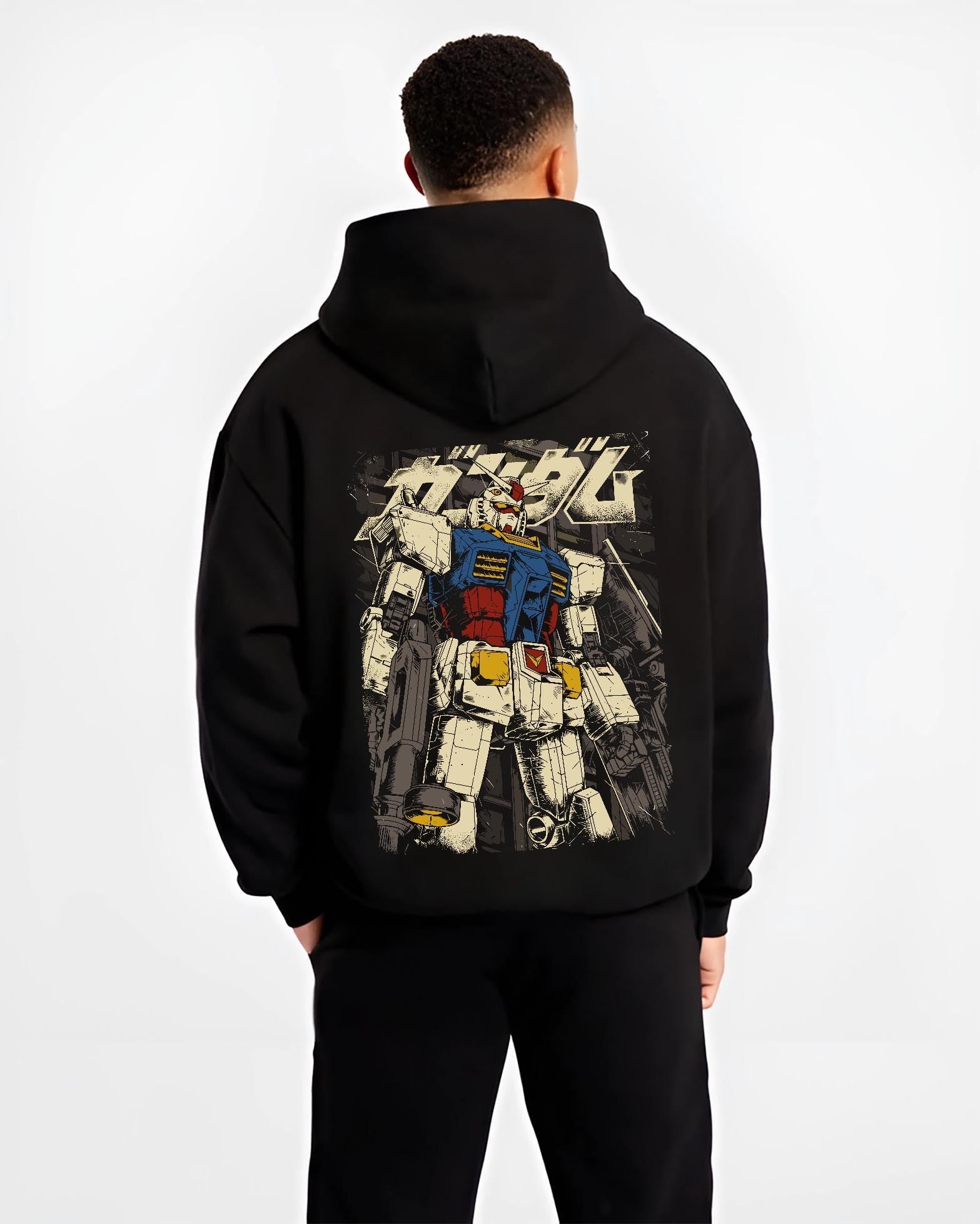 Black hoodie worn by a male model, back view, featuring RX-78-2 Gundam anime poster inspired retro mecha graphic with nostalgic Japanese animation streetwear style