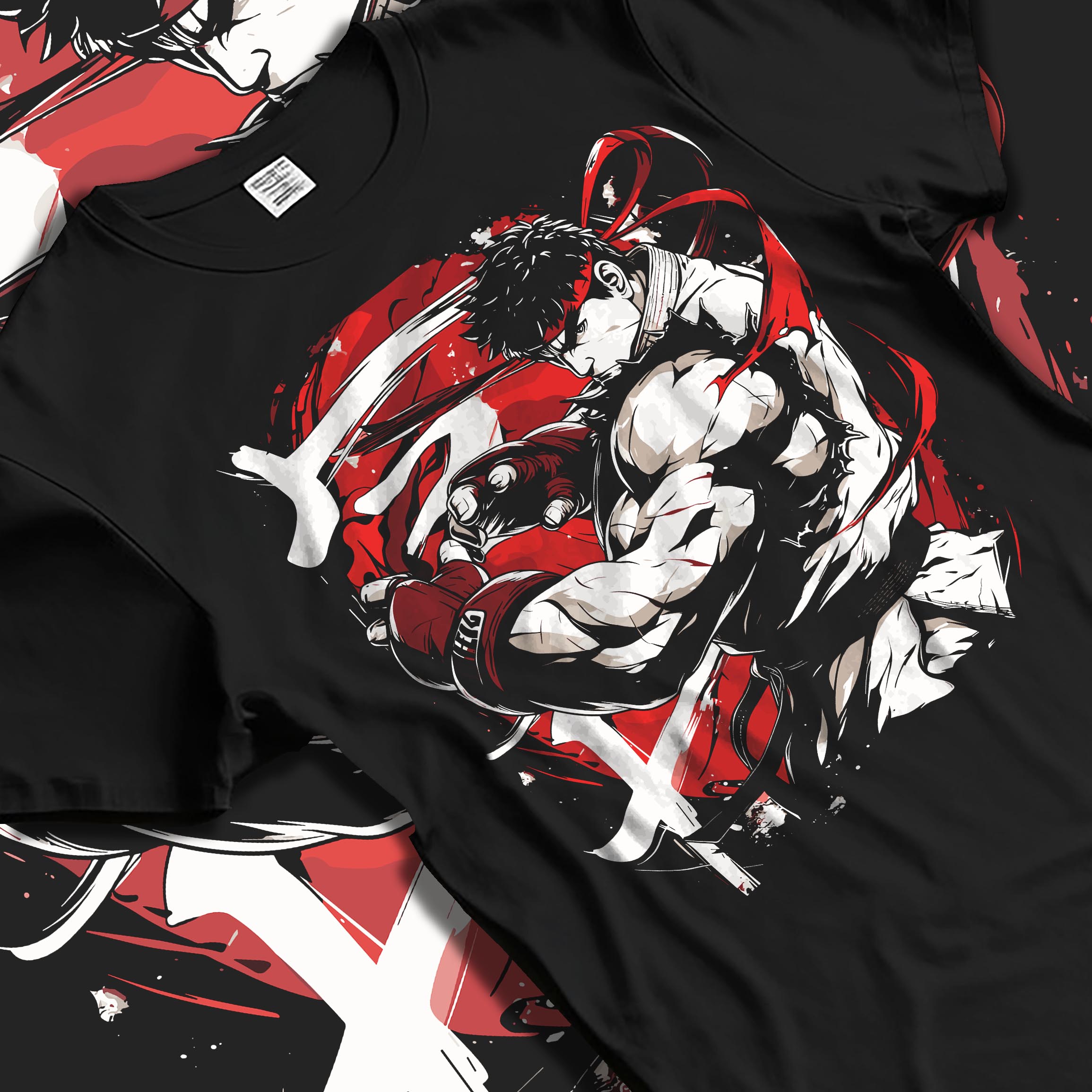 Black T-shirt laid flat with natural fabric folds, featuring Ryu Street Fighter fighting game inspired artwork with bold red swirl and classic martial arts stance.