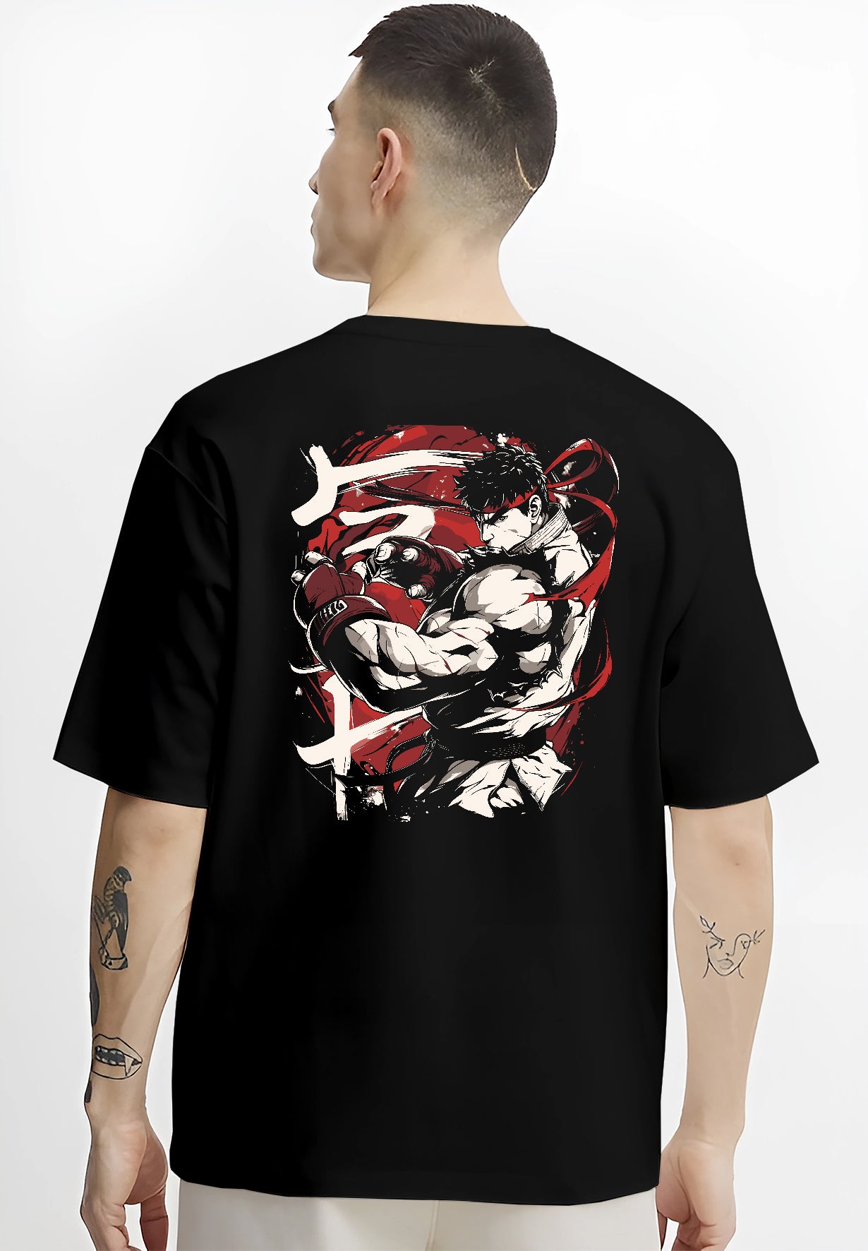 Black T-shirt worn by a male model, back view, featuring Ryu Street Fighter retro manga design with clenched gloves, red headband, and striking combat pose.