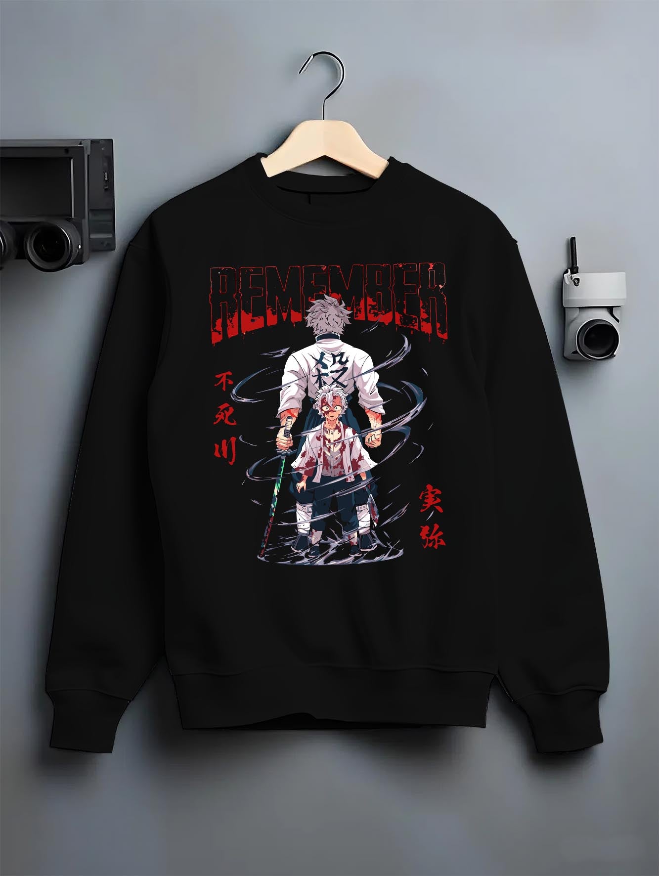 Black crewneck sweatshirt on a hanger against a grey wall, featuring Sanemi Demon Slayer retro streetwear graphic with emotional manga panel and dramatic anime detail.