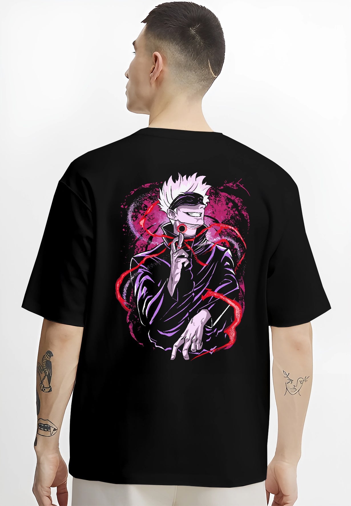 Black T-shirt on male model, back view, featuring Gojo Satoru retro manga graphic with red energy, magenta aura, and bold streetwear finish.