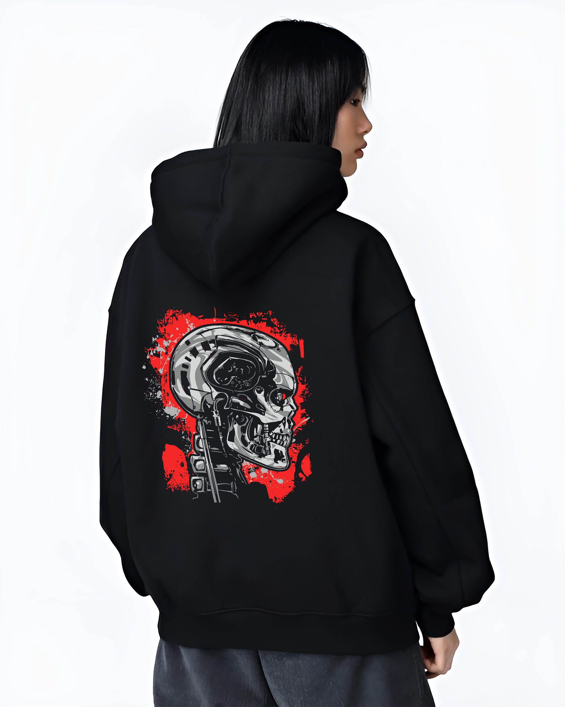 Black hoodie on female model, back view, featuring Terminator T-800 mecha skull design with neo-noir sci-fi vibe.