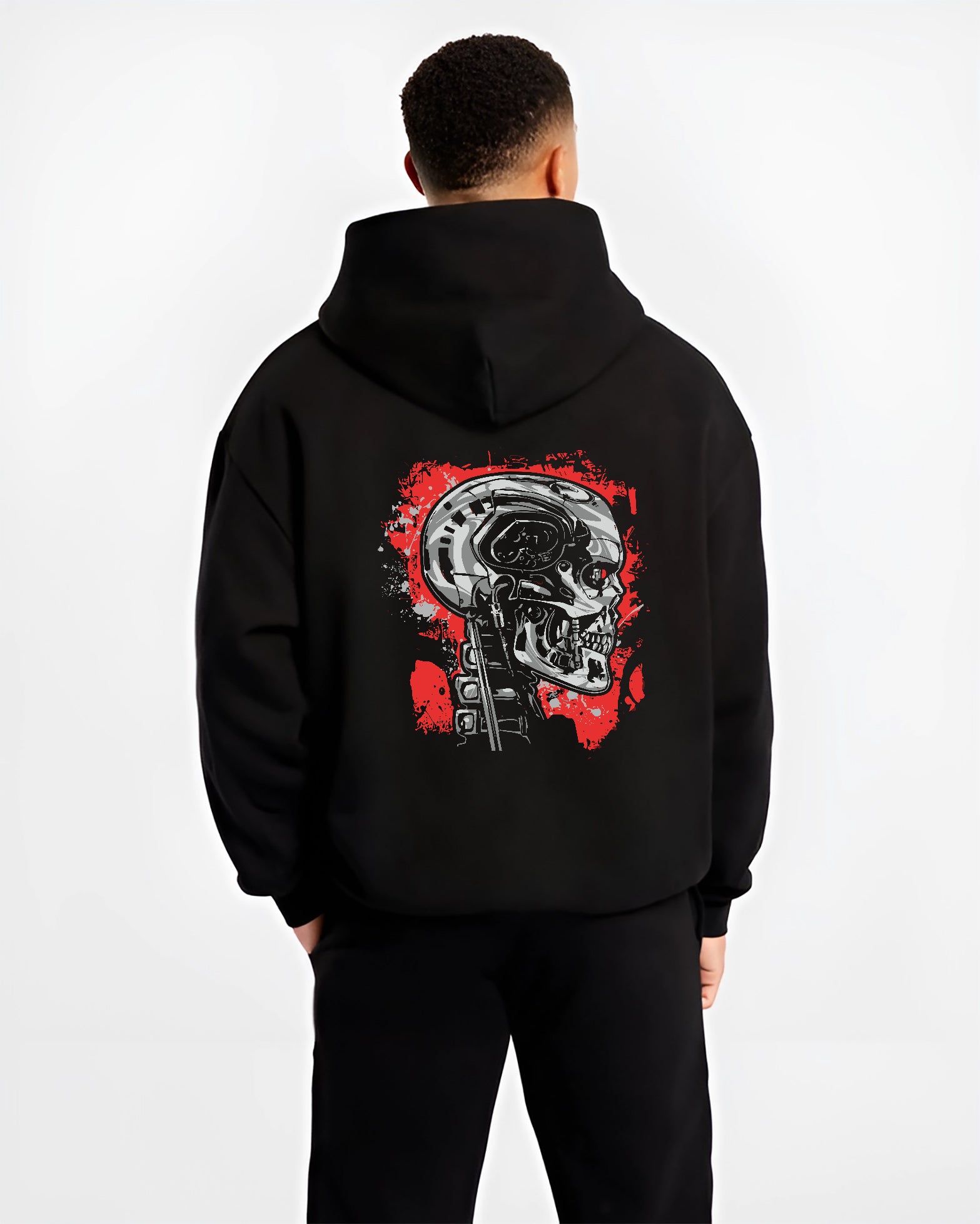 Black hoodie on male model, back view, featuring Terminator T-800 cyberpunk skull artwork in retro sci-fi film style.